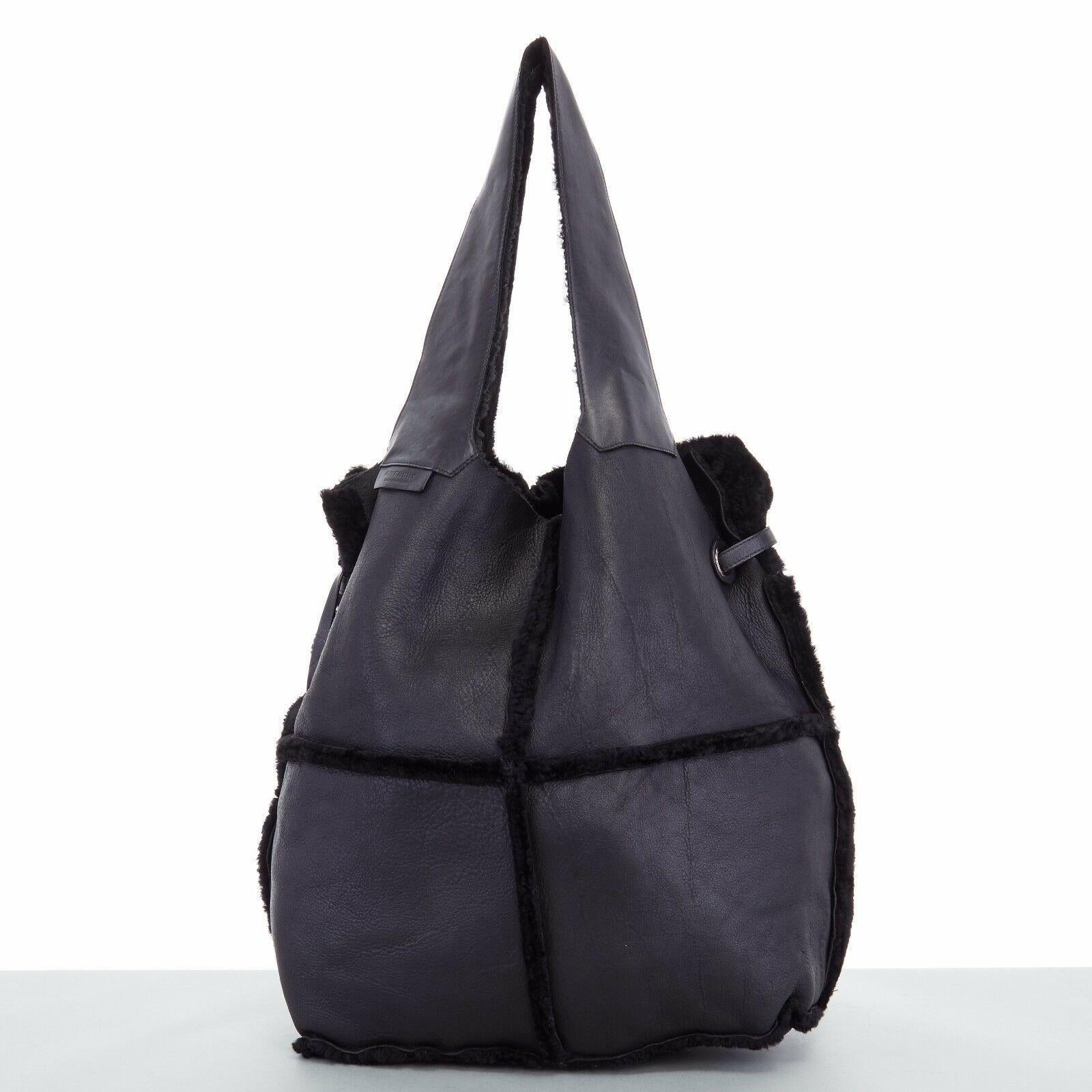 GIVENCHY TISCI black reversible leather shearling fur oversize hobo shoulder bag
GIVENCHY BY RICCARDO TISCI
Reversible shearling and calf leather hobo bag . 
Black soft smooth leather and shearling . 
Oversized hobo shoulder bag . 
Silver grommet