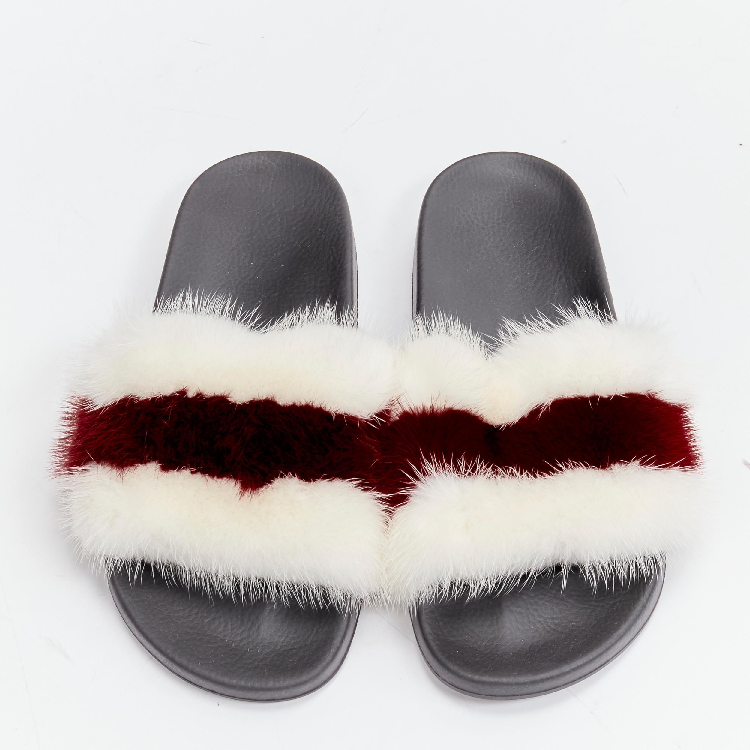 GIVENCHY Tisci schwarze Pool slides mit rot-weißen Streifen und geprägtem Logo aus Fuchspelz EU38
Referenz: LNKO/A02098
Marke: Givenchy
Designer: Riccardo Tisci
MATERIAL: Pelz, Gummi
Farbe: Rot, Weiß
Muster: Gestreift
Verschluss: Slip