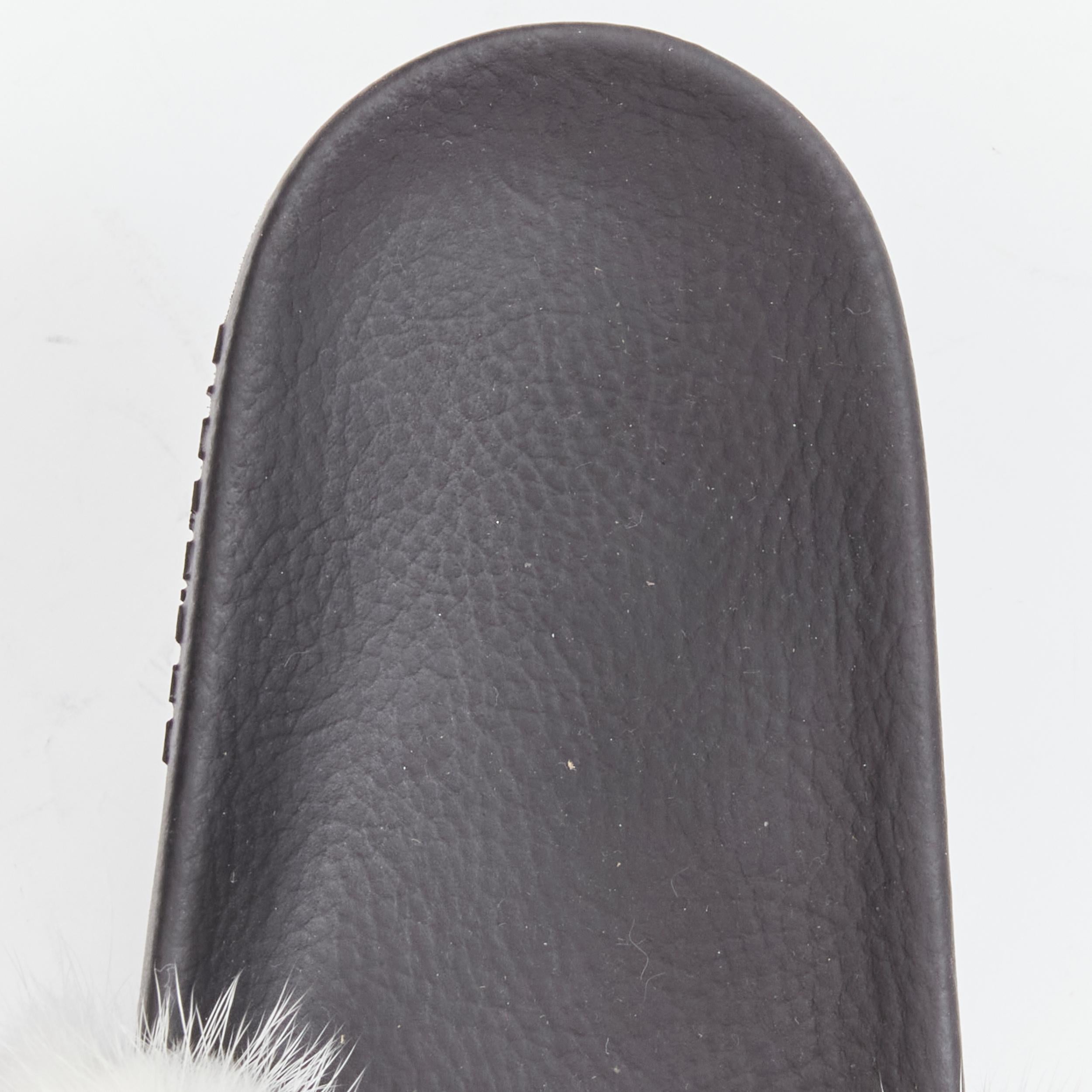 GIVENCHY Tisci schwarze Pool slides mit rot-weißen Streifen und geprägtem Logo aus Fuchspelz EU38 im Angebot 4