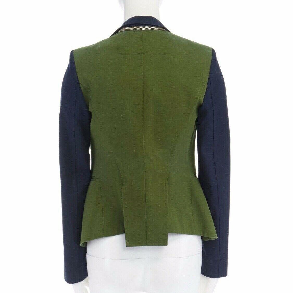 GIVENCHY TISCI military green navy blue sleeve zip collar cutaway jacket FR34 XS

GIVENCHY BY RICCARDO TISCI
Cotton, cupro, acetate, polyester . Military green body . Navy blue sleeves . 
Gold exposed zipper detail on collar . Spread notched collar