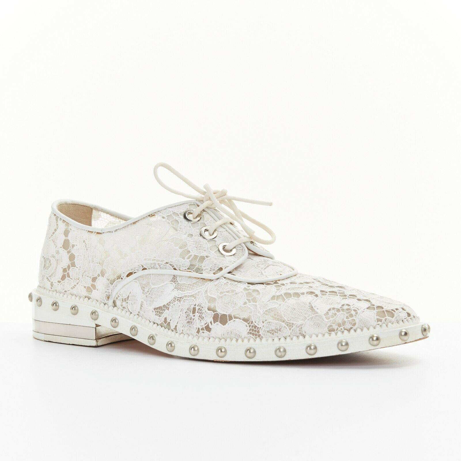 GIVENCHY TISCI white floral lace mesh silver stud outsole lace up brogue EU39

GIVENCHY BY RICCARDO TISCI
Black lace covered nude mesh upper. White leather piping. Silver-tone hardware. 
Lace up front. Almond round toe. Stacked wooden sole.