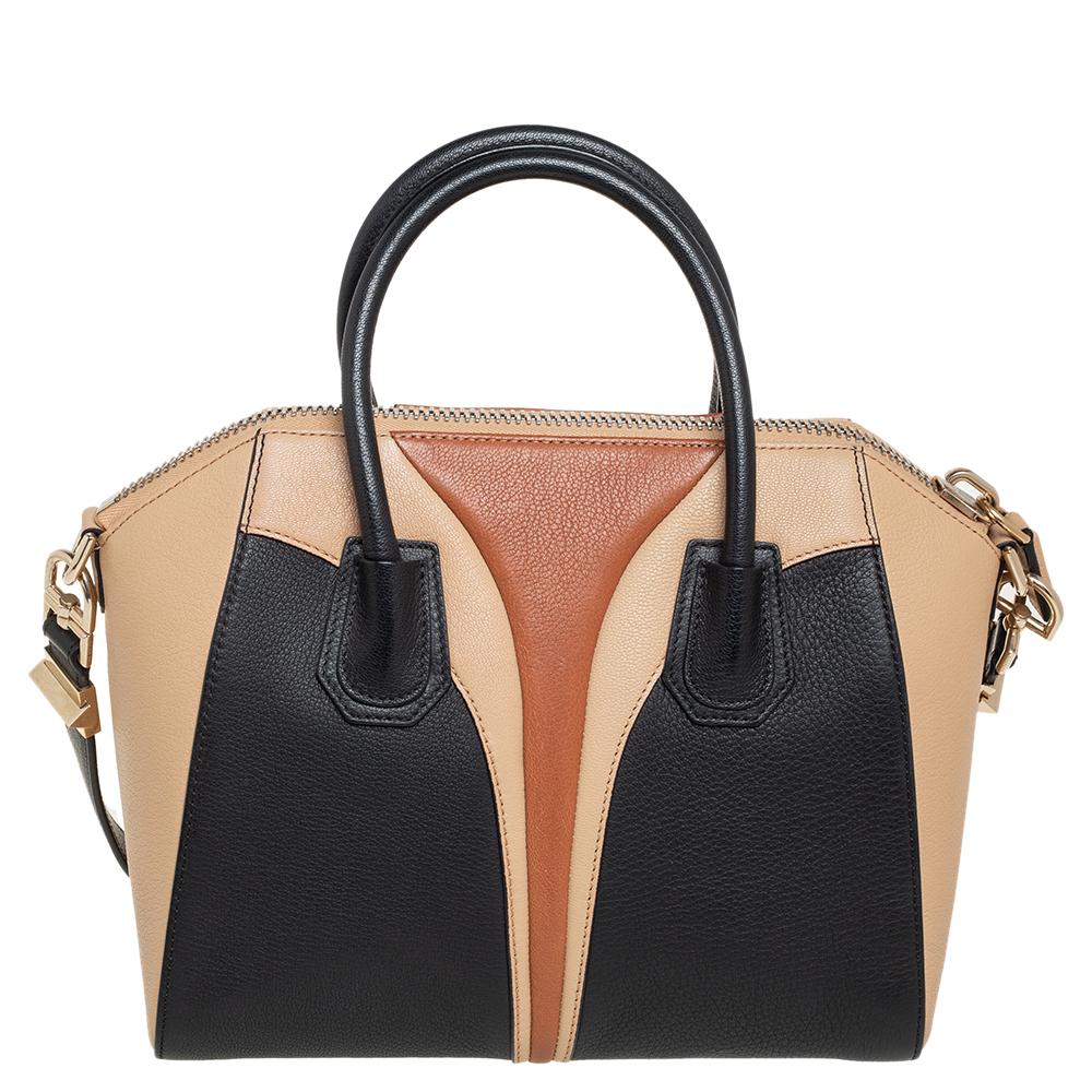 Made in Italy, and loved by women worldwide is this beautiful Antigona satchel by Givenchy. It has been crafted from leather and shaped elegantly. The tricolored bag has a top zipper that reveals a canvas interior and it is held by two top handles