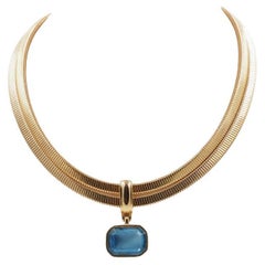 Catena Tubogos Givenchy con ciondolo con pietra blu