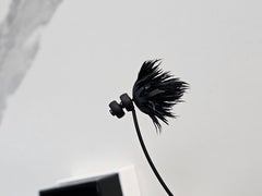 Givenchy unique earring, feather, fashionable futuristic design! Black fall 2023