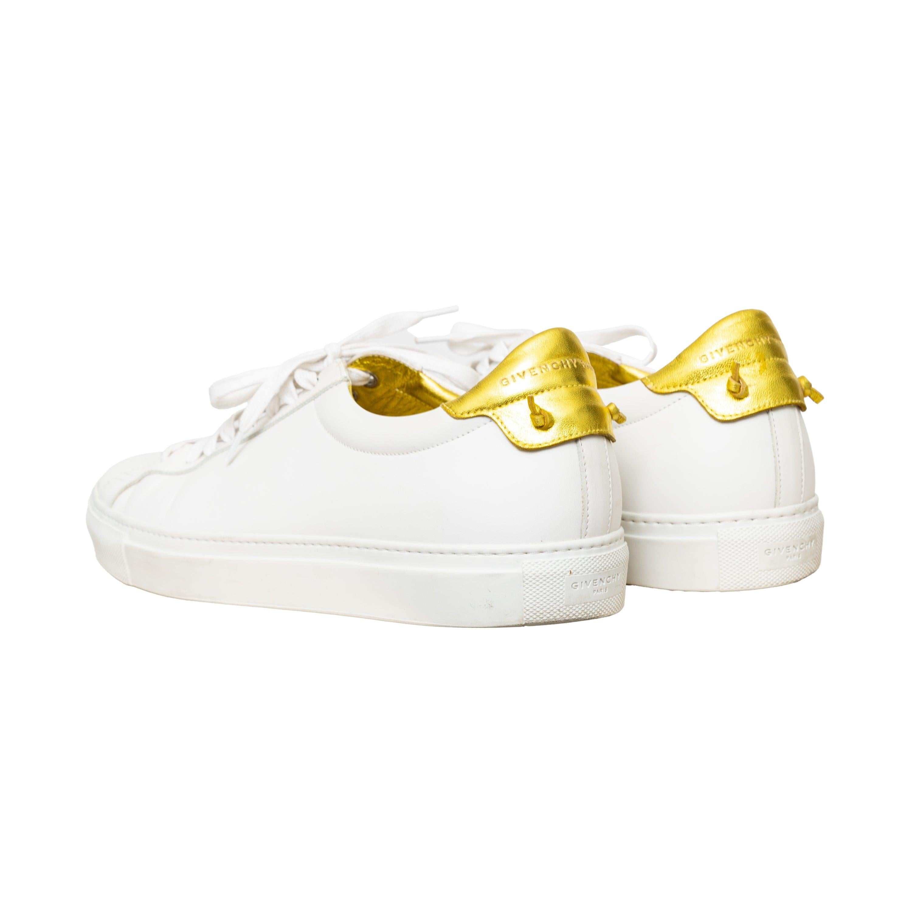 Givenchy sneakers in white leather, classic low-top design with a golden interior and back tab for a luxurious touch to a classic everyday footwear. 
 Measurement: Insole Length:30;Heel:3 
 Material: Leather
