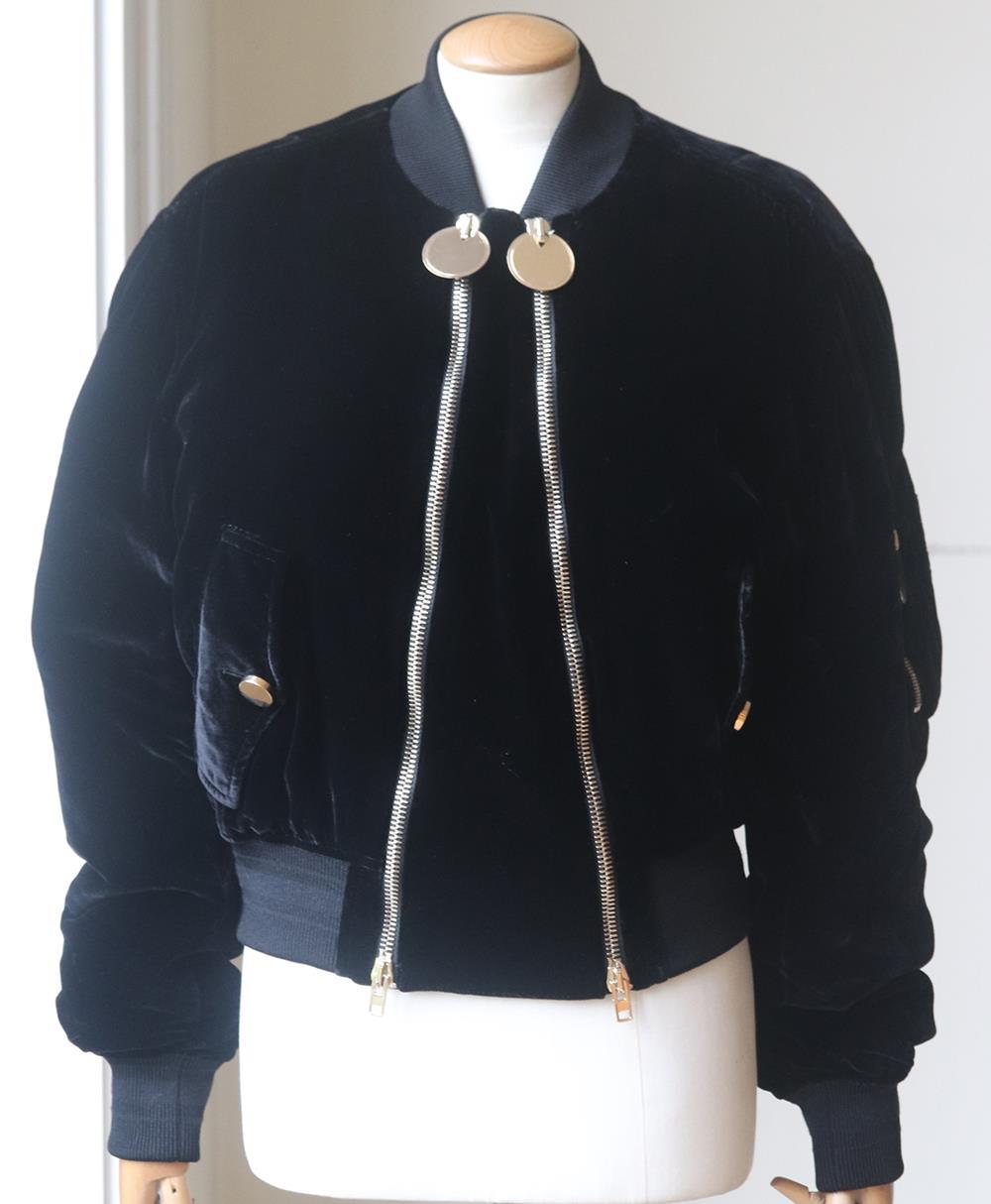 Velvet is the fabric for winter, Givenchy's bomber jacket is detailed with gold disc zips, flexible ribbed trims and a satin lining for the smoothest fit, take a cue from the runway and style yours with an all-black outfit. Black velvet. Two-way zip