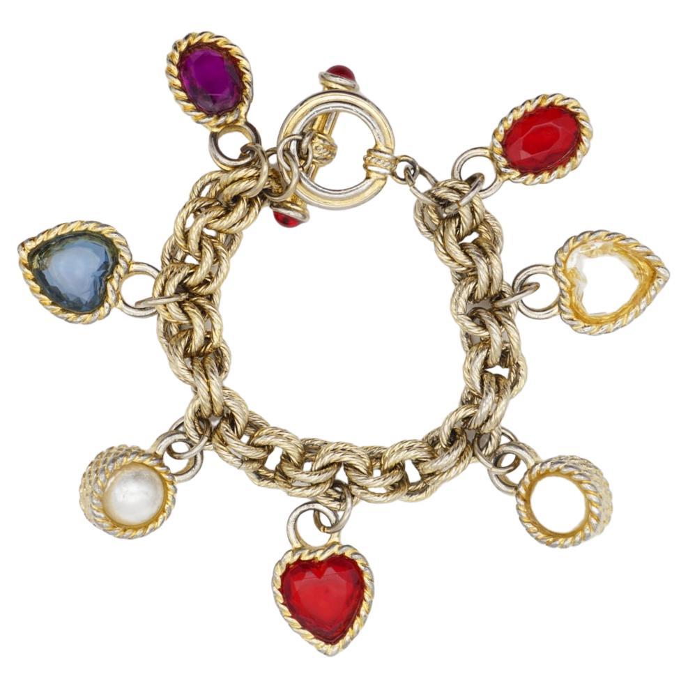 Givenchy Vintage 1980 Gripoix Pearl Heart Circle Oval Red Blue Purple White Charm Elegant Modernist Bracelet, Gold Tone.

Bon état. Quelques légères rayures ou pertes de couleur, notamment au niveau de la chaîne. 100% authentique. 

Le fermoir à