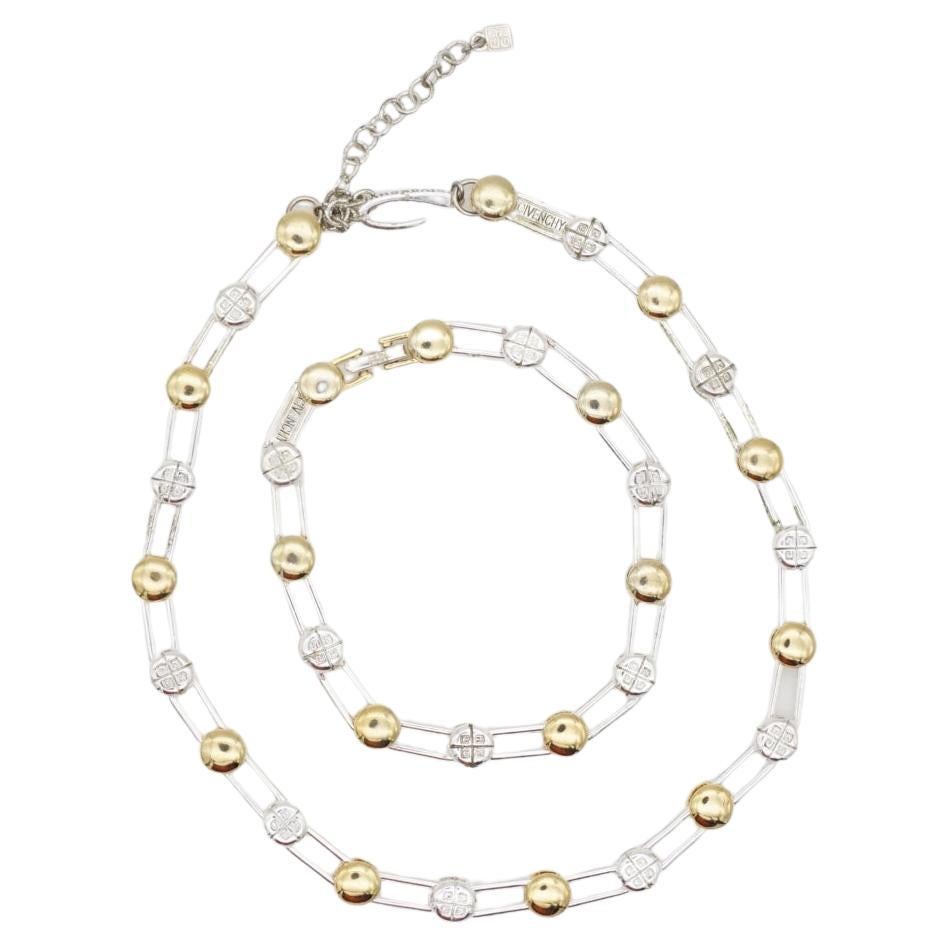 Givenchy Vintage 1980s Iconic Logo Monogram Crystals Gift Set, Necklace Bracelet, Gold Silver Tone

Very good condition. Some light scratches or colour loss. 100% genuine. 

Signed at the back. Both can be adjustable. Come with original box.

Size: