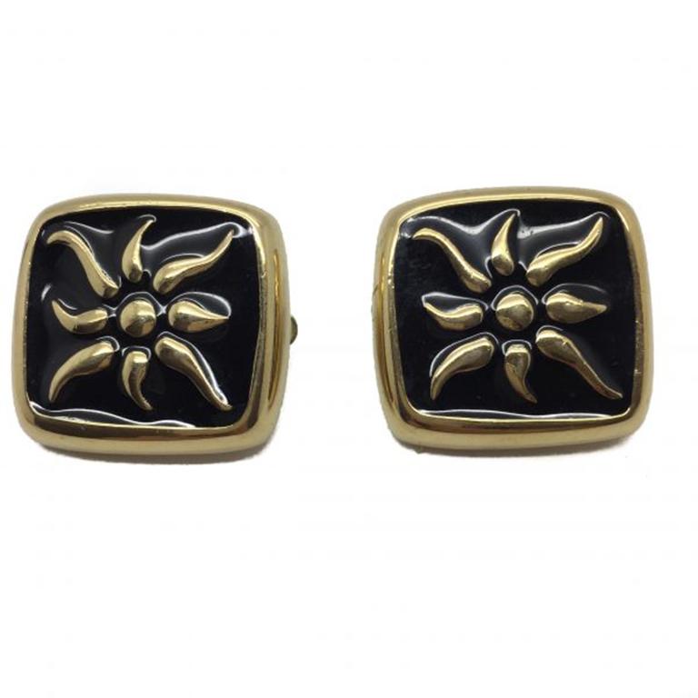 An unusual and striking pair of Vintage Givenchy Earrings from the 1990s. These Givenchy Earrings feature a dramatic and beautifully made gilt starburst amidst deep rich black enamel. A fabulous piece of vintage Givenchy jewellery that will always