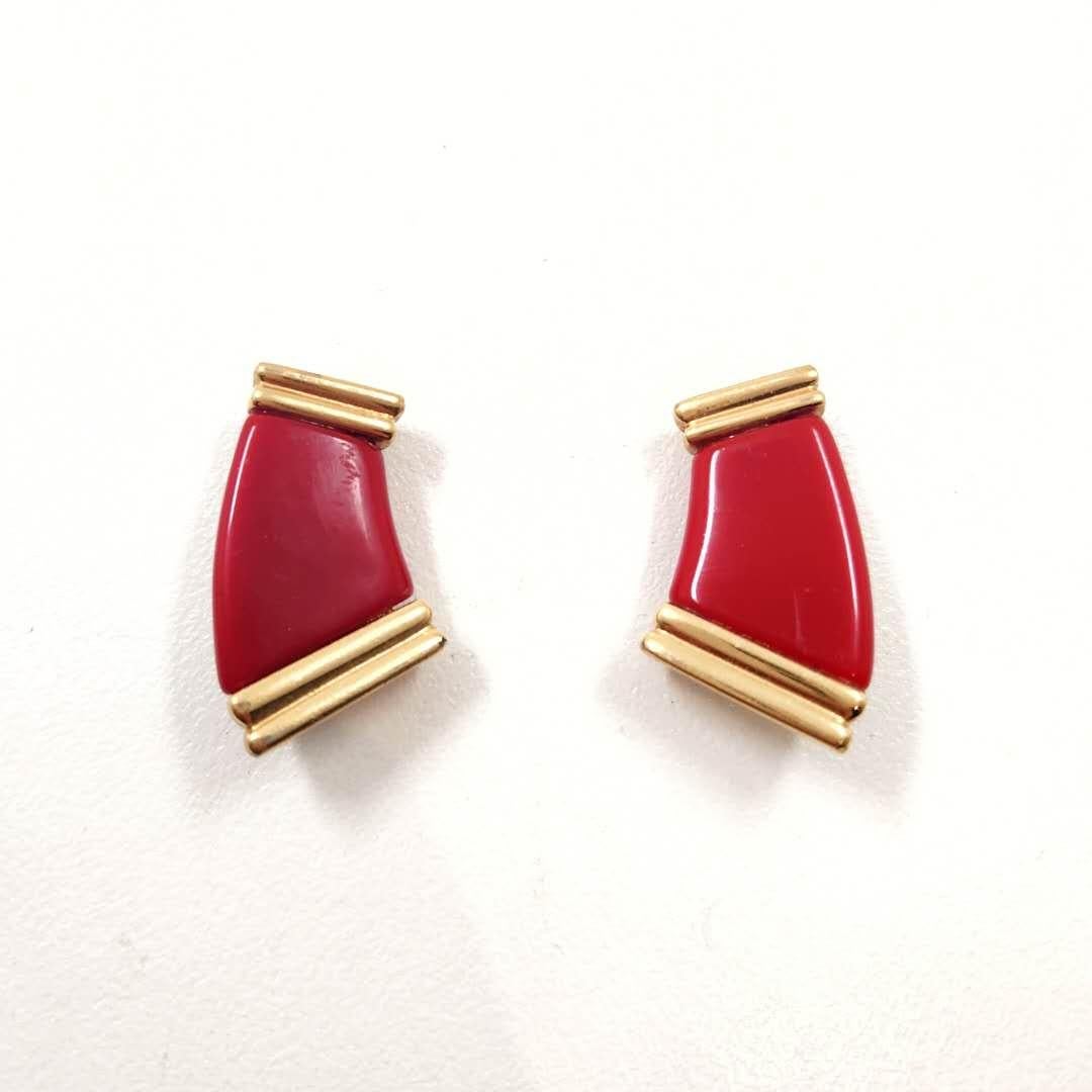 Introducing the Givenchy Red Enamel Curved C Shape Gold Etruscan Clip On Earrings, a stunning fusion of bold design and luxurious craftsmanship. These earrings are a true embodiment of Givenchy's iconic style, exuding confidence and