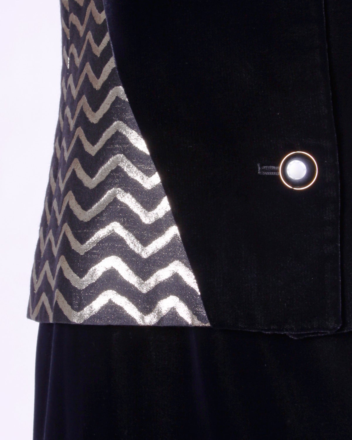 Elegant vintage suit by Givenchy featuring black silk velvet and metallic gold and black chevron patterned fabric blocking. Wear the skirt and jacket together or separately!

Details:

Fully Lined
Front Button Closure On Top/ Side Zip and Hook
