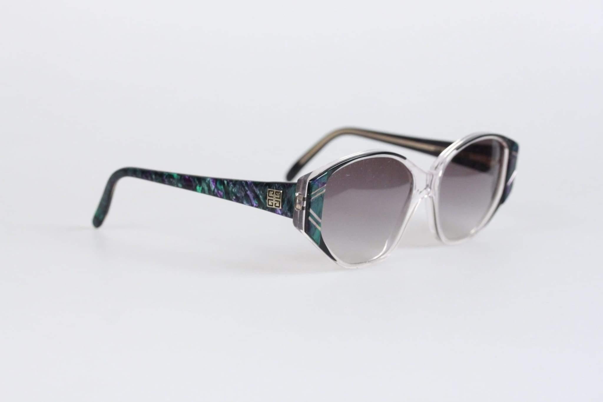MATERIAL: Acetate COLOR: Green, Purple LENS COLOR: Grey MODEL: G8915 -009- 54/15 GENDER: Womens SIZE: Medium CONDITION DETAILS: NOS - New Old Stock - Never worn or used - It will come with a Generic Case MEASUREMENTS: TEMPLE MAX. LENGTH: 130 mm