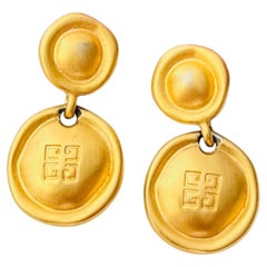 Pendientes de Givency Vintage, unisex, icónicos, exclusivos, con 4 botones y acabado dorado mate, con diseño perforado