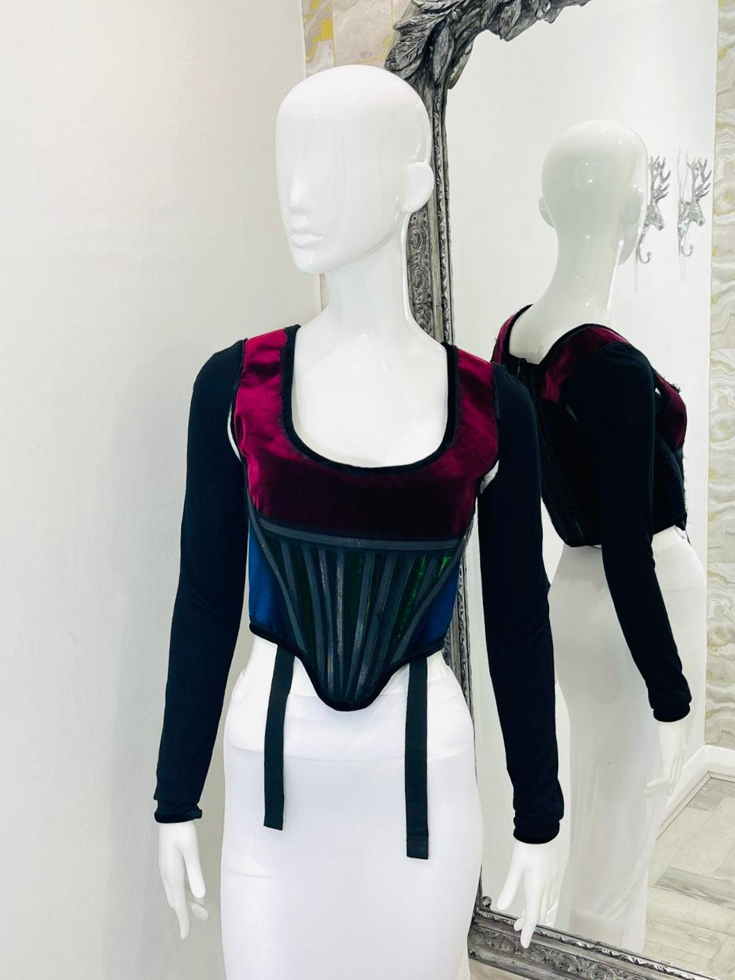 Givenchy Velvet Trim Corset

Black fringed/raw edged with bright red and dark green velvet detailing. Long Sleeves with cut out areas to arms. From 2013 runway collection. Rare item.

Additional information:
Size – 40FR
Composition- Velvet, 25%