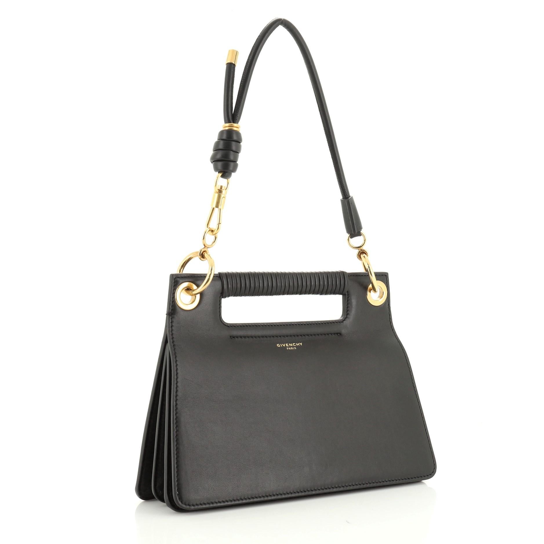 This Givenchy Whip Shoulder Bag Leather Small, crafted from black leather interior, features cutout and wrapped top handle, knotted shoulder strap, exterior zip pocket and gold-tone hardware. Its push-lock closure opens to a neutral microfiber