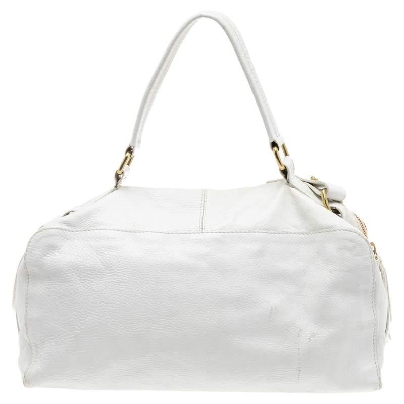 This white bag comes from the fashion house of Givenchy. Crafted from leather, it features a canvas interior that ensures to house your everyday essentials. The East West bag is complete with a buckle detail on the front and a single handle on