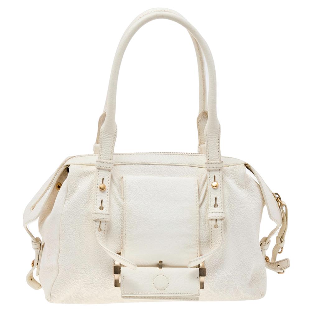 Flaunt the latest fashion with this Givenchy bag that is elegant yet trendy. This leather creation has shoulder handles and is accented with gold-tone hardware. Its fabric lined interior adds to its strength and durability. This radiant white