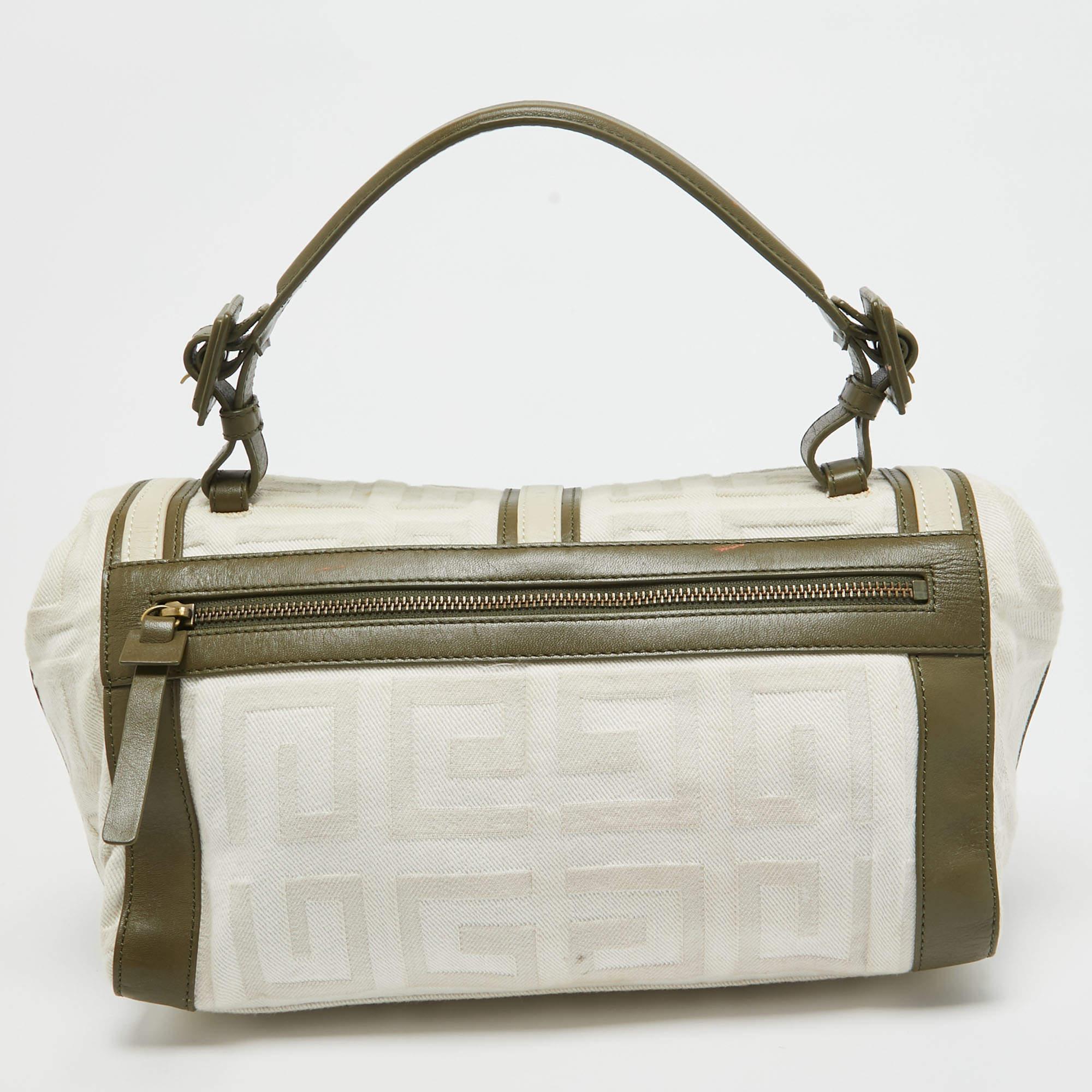 Exuding unparalleled elegance and sophistication, this bag is made from the finest material in a gorgeous hue. While the roomy interior offers ample space, the top handle allows you to carry it with much elegance.

