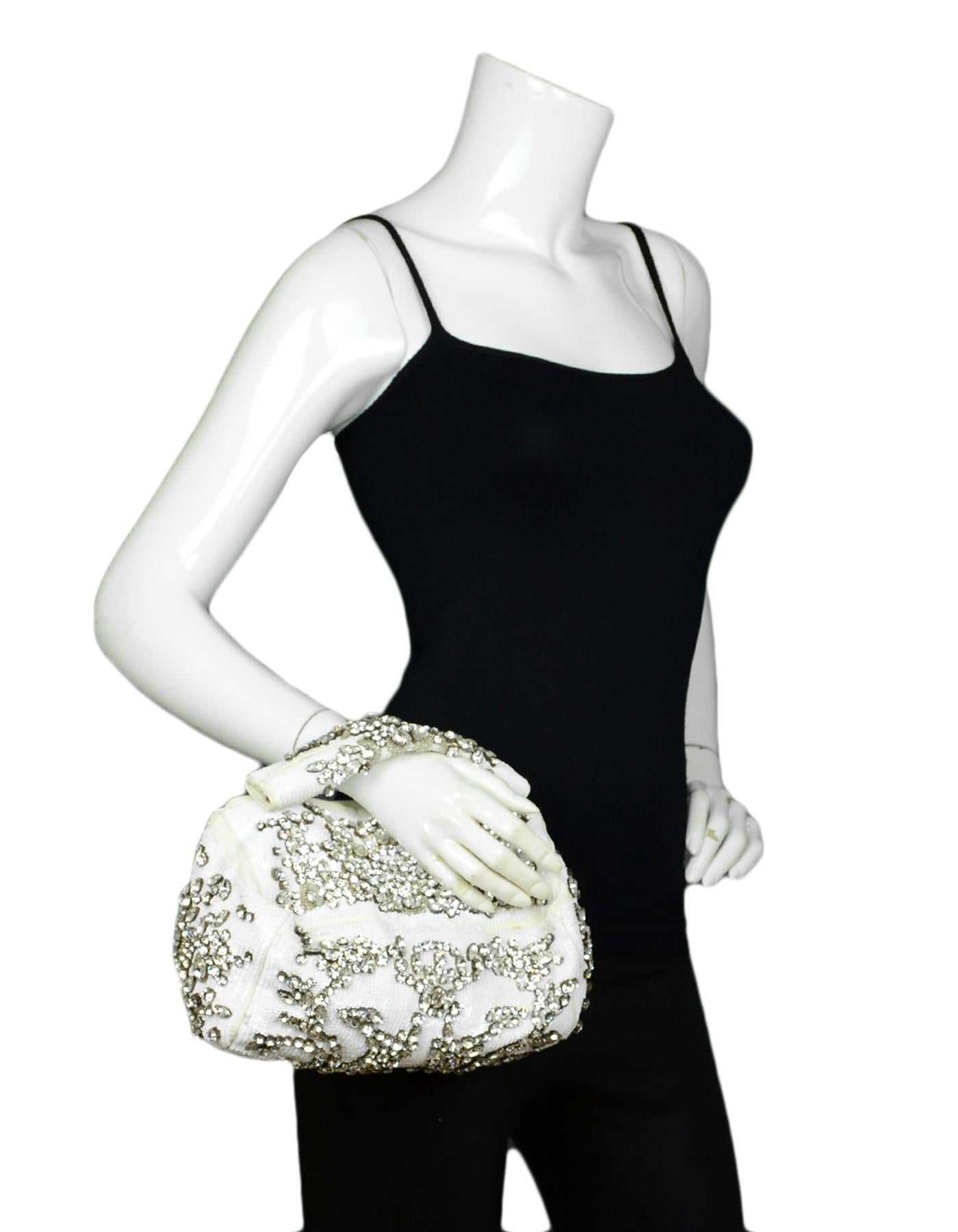 Givenchy White Sequin & Crystal Embellished Mini Pandora Clutch Bag

Made In: Italy
Year of Production: 2010
Color: White
Hardware: White, SIlvertone
Materials: Sequins, Leather, Crystal
Lining: Fine textile lining
Closure/Opening: Top zip
Exterior