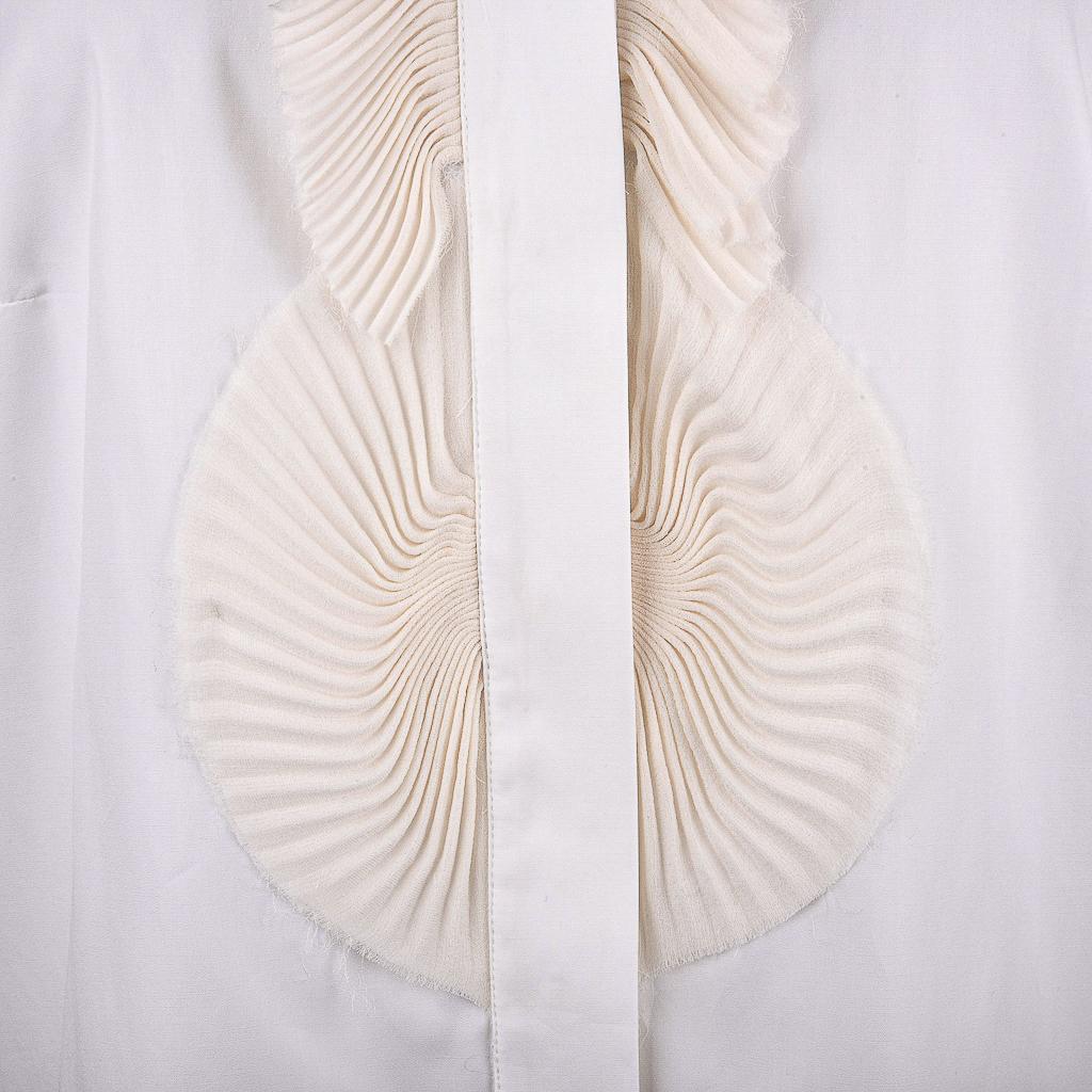 Guaranteed authentic Givenchy white blouse. 
Cream silk chiffon pleated design around hidden placket.
Elbow sleeve with 2 buttons.
Stitch detail at rear.
Fabric is cotton with silk chiffon. 
NEW or NEVER WORN
final sale 

SIZE 44
USA SIZE 10

TOP