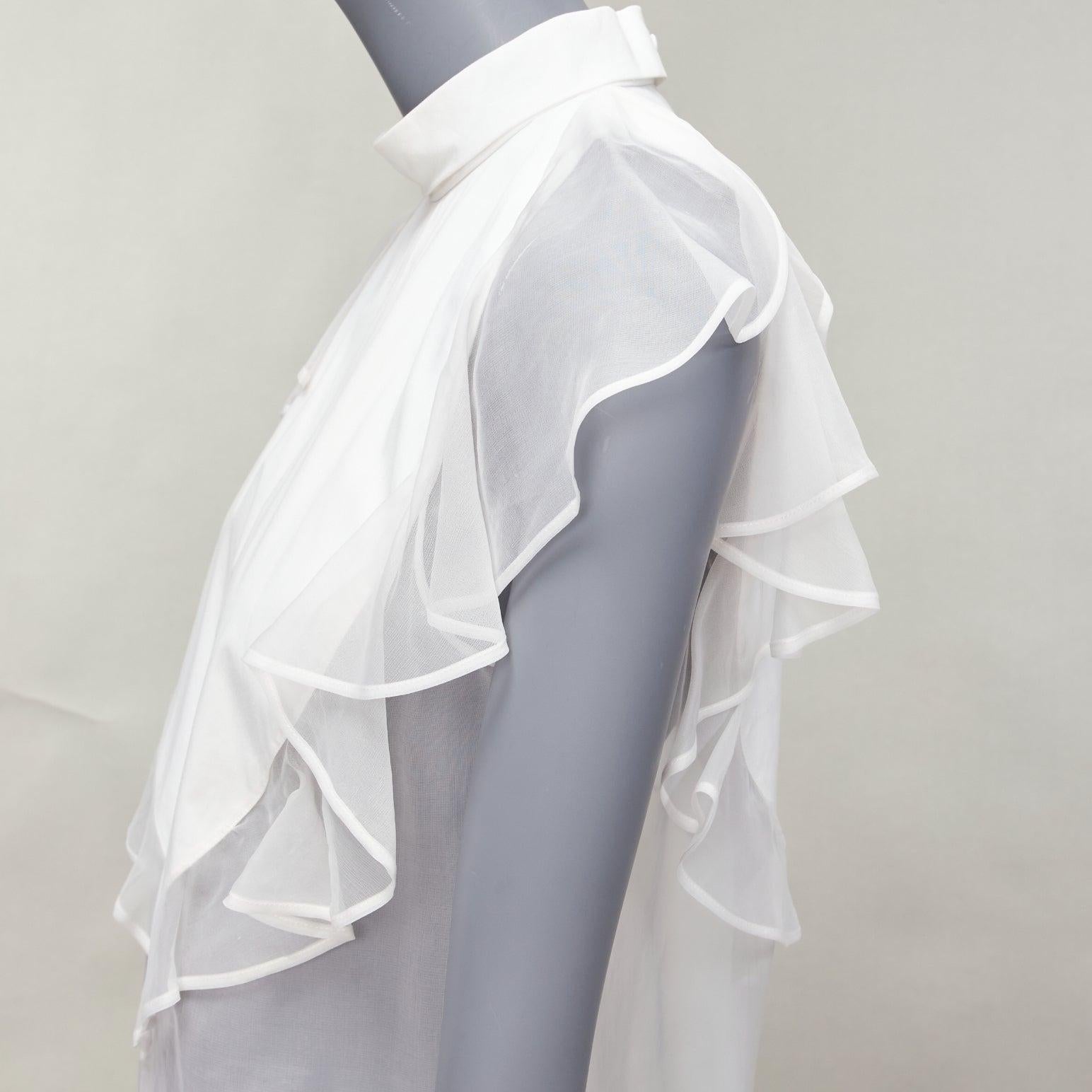 GIVENCHY white silky sheer ruffles front hi neck collar sleeveless shirt
Reference: NKLL/A00172
Brand: Givenchy
Designer: Riccardo Tisci
Material: Feels like cotton
Color: White
Pattern: Solid
Closure: Zip
Lining: White Fabric
Extra Details: Back