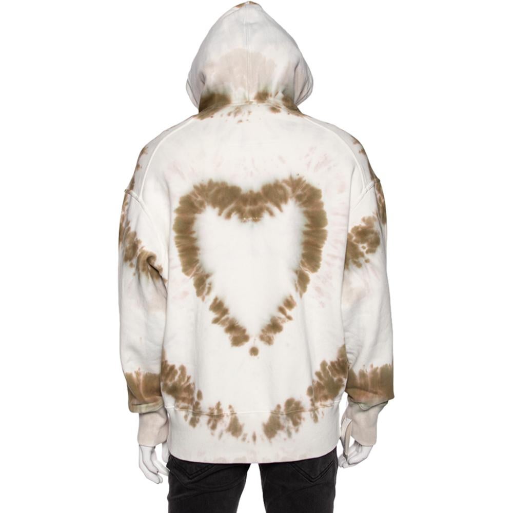 Step out in style with this cool Givenchy oversized hoodie. Coming in a tie-dye heart print, the white hoodie is the epitome of comfort and trendy fashion. It has been made using cotton, which makes it super comfortable and perfect for daily wear.

