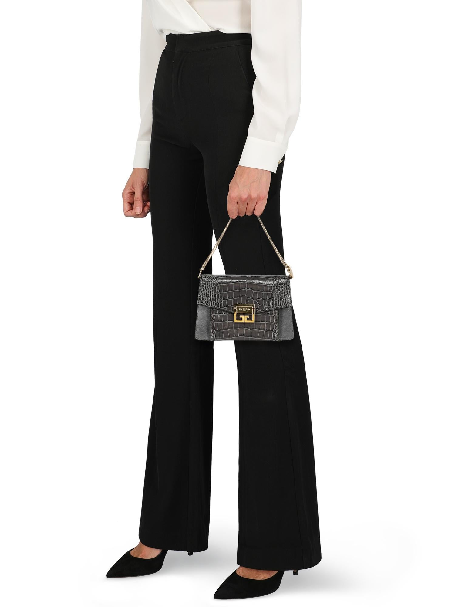 Cross body bag, leather, crocodile print, front logo, removable shoulder strap, gold-tone hardware, internal zipped pocket, multiple internal compartments, evening

Includes:
- Dust bag

Product Condition: Excellent
Lining: negligible stains.