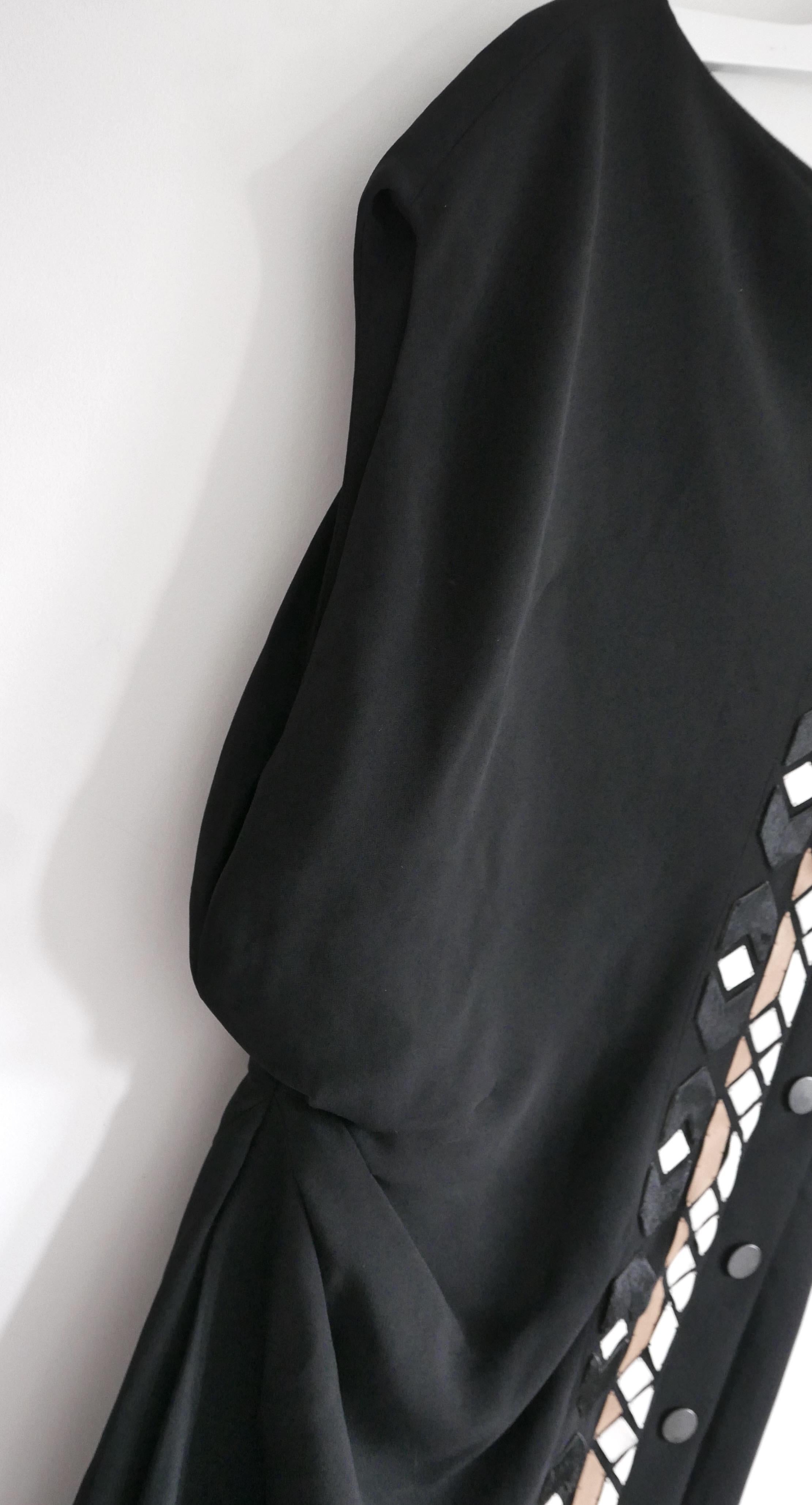Super cool Givenchy embellished dress from Riccardo Tisci’s Pre-Fall 2013 collection. New with tags. Made from matte black viscose and elastane crepe with acetate mix lining. It has an asymmetric cut with hand stitched geometric leather
