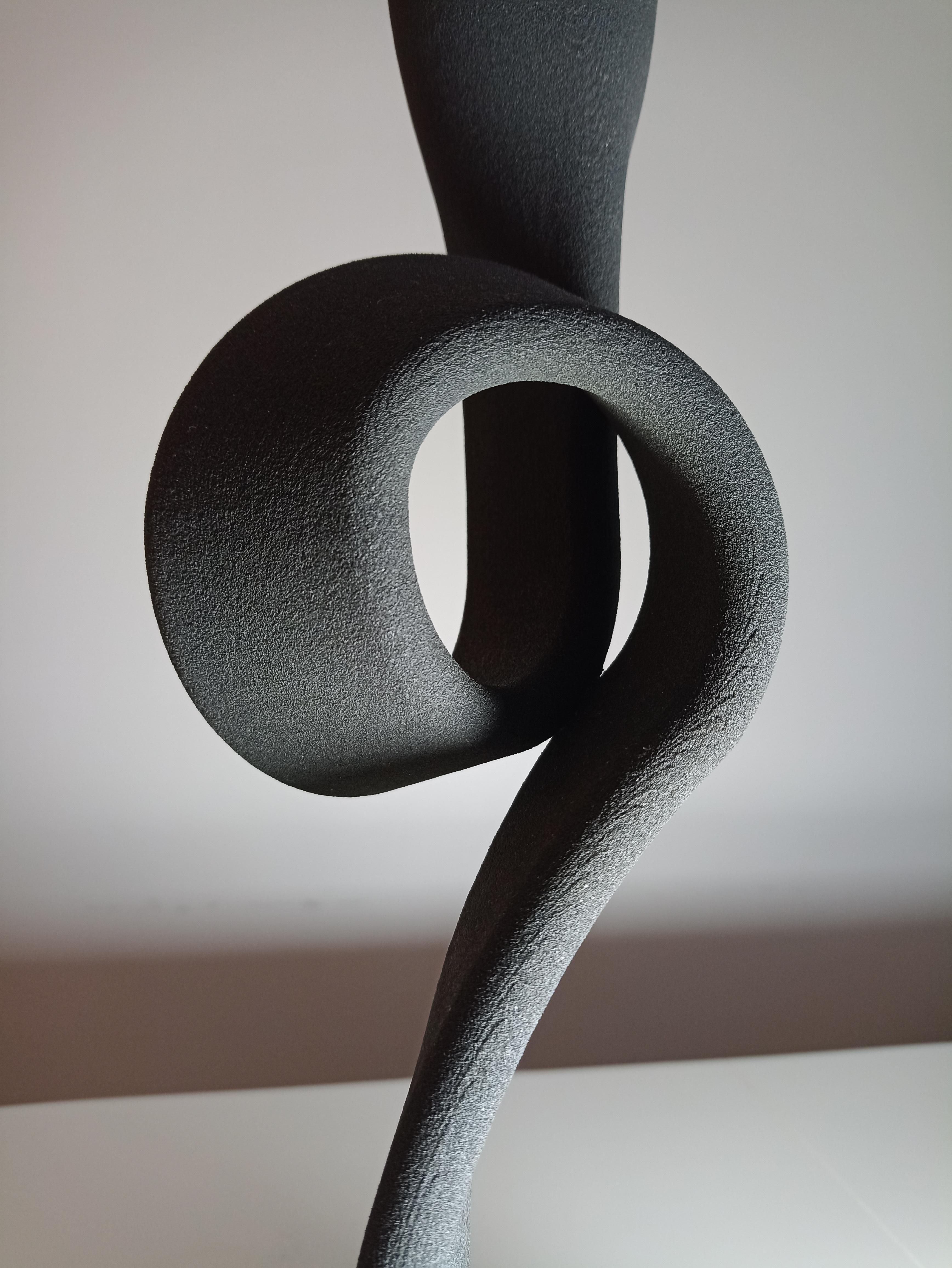 A candeleholder crafted through 3D printing using sand.