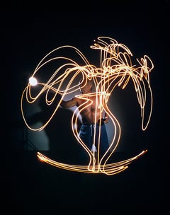 Pablo Picasso creating light drawing of vase of flowers, Vallauris, France, 1949