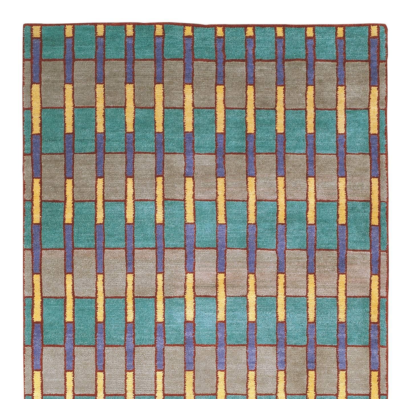 This carpet designed by George J. Sowden is part of a 36-piece series signed by the designer and entirely handmade in Nepal by artisans who still use ancient artisanal methods in working the Tibetan wool, knotting it by hand, dying it by hand, and