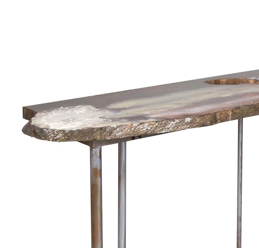 This exclusive sculpture-table is both decorative and functional and will be a statement addition to a contemporary interior. The top is made of solid paulownia and fir from salvaged trunks, that are treated with epoxy resins, acrylics, and stucco