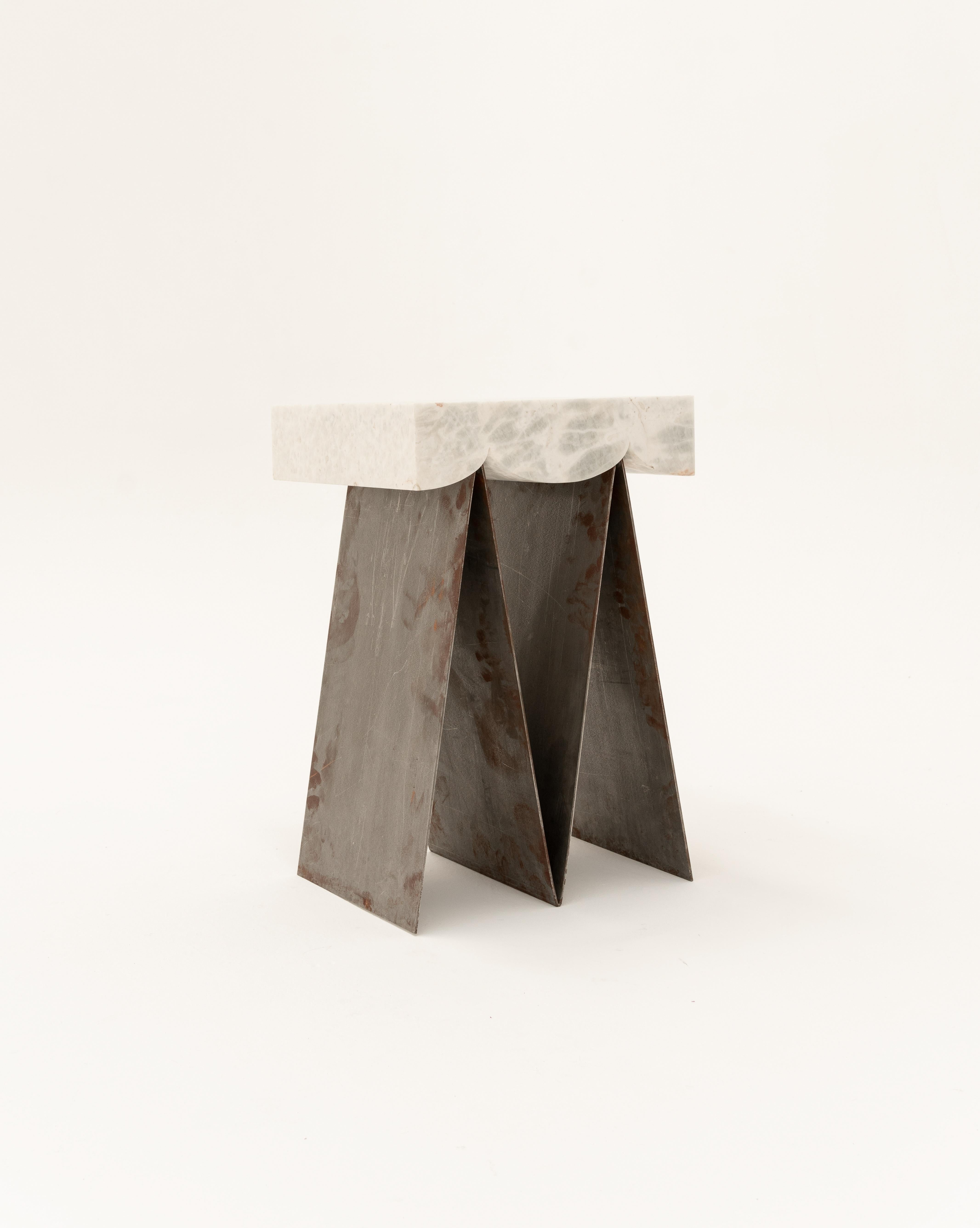 Understood as the material of progress and as an emblem of the modern movement from the middle of last century, steel is the fundamental axis of the Glacier collection. 

The item is a segmented side table conformed by two pieces that fit