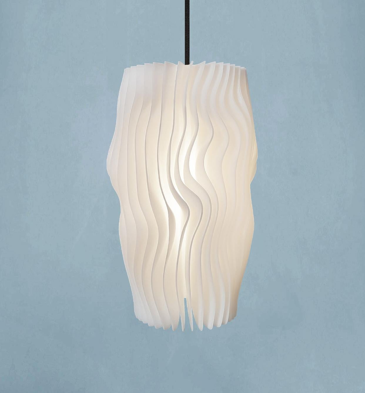This object is a limited edition (1/330) Swiss Design Pendant lamp from the first Glacier series - inspired by the organic shape of glacial ice layers - brand new in the box with certificate and International Lifetime Warranty, several consecutively