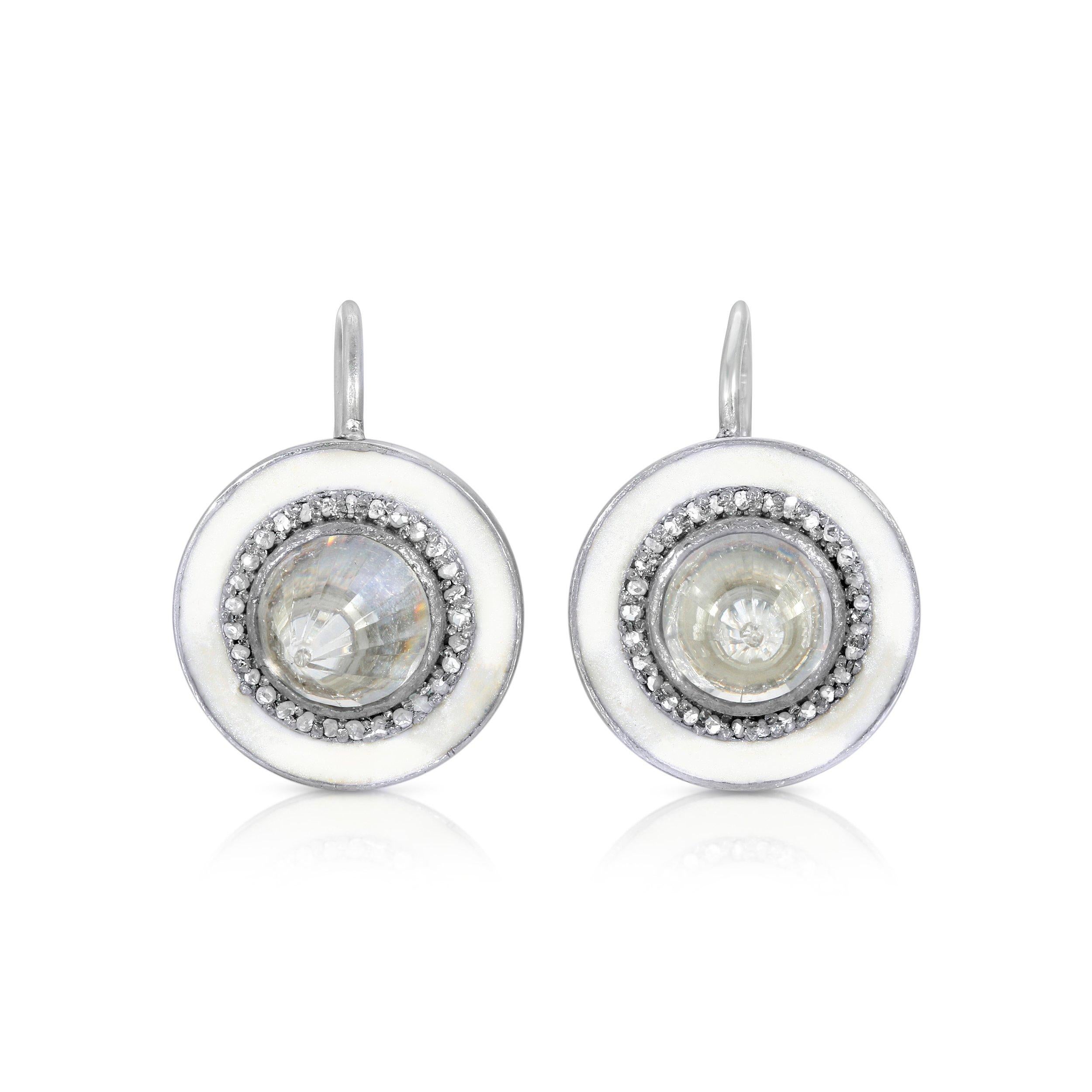 Beautifully faceted glacier white Crystal Quartz points in an iridescent halo of Mother of Pearl white enamel set with sparkling white Diamonds in 14 karat white gold and silver drop earrings.

- Natural White Crystal Quartz weight approx 10.50