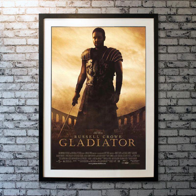 Gladiator, Unframed Poster, 2000

Original One Sheet (27 X 40 Inches). Commodus (Joaquin Phoenix) takes power and strips rank from Maximus (Russell Crowe), one of the favoured generals of his predecessor and father, Emperor Marcus Aurelius, the