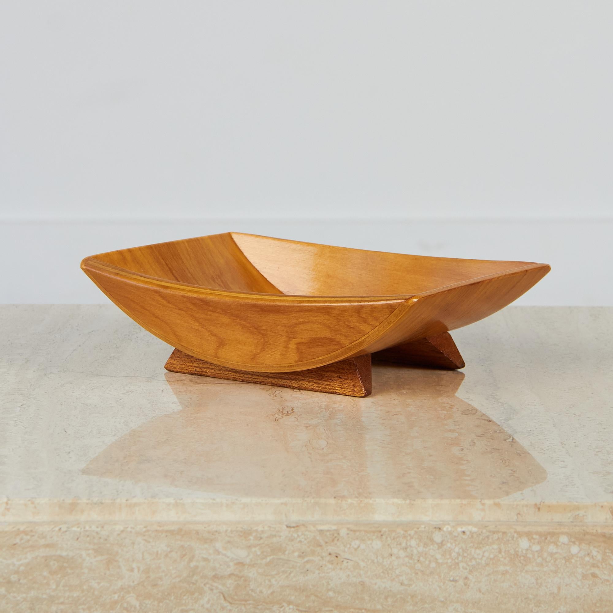 A walnut footed bowl by Gladmark, c.1960s made in Burbank, California. Each tray would be special on its own, or make a statement together for your next gathering featuring an abundance of nuts, cheeses and other snacks. Each bowl has been oiled to