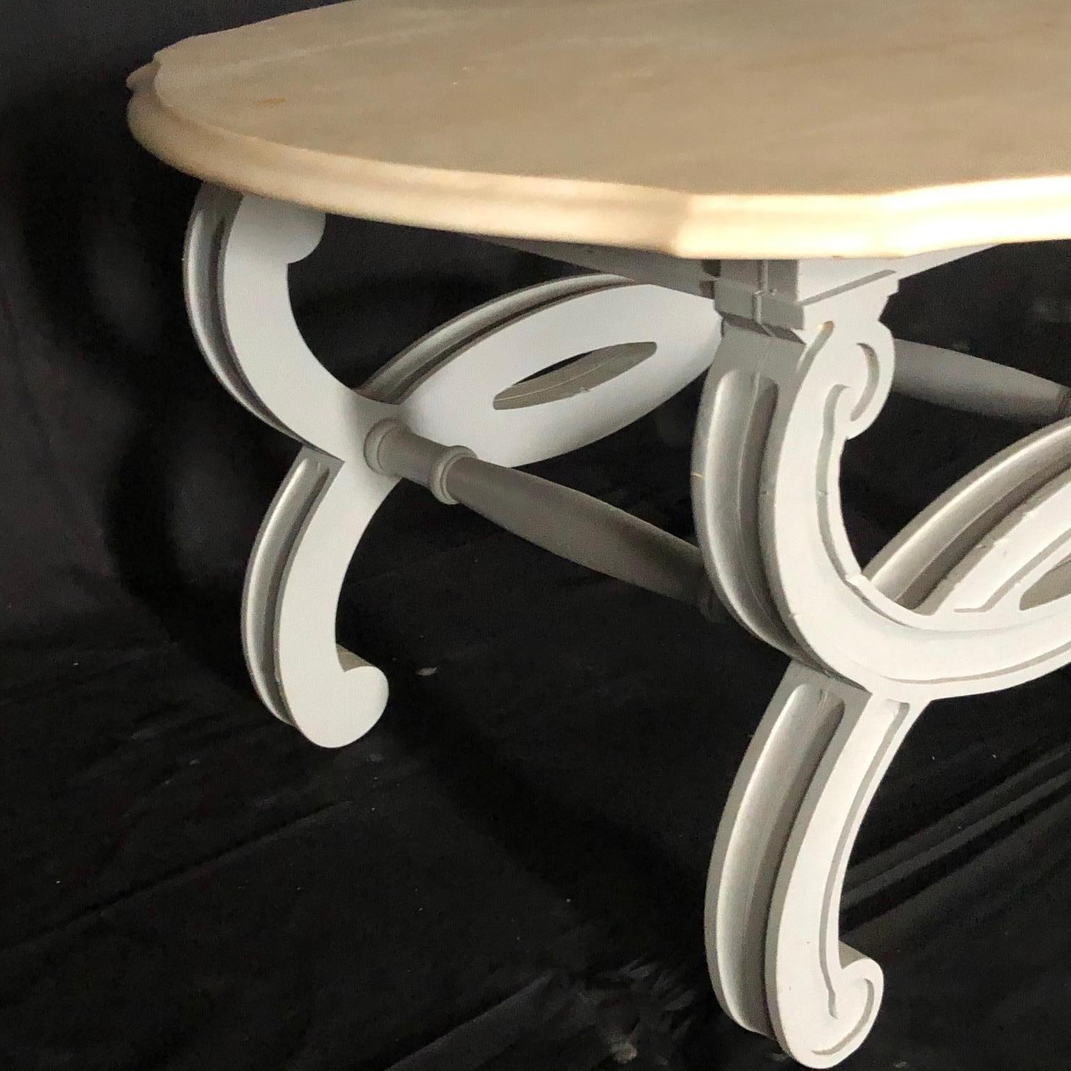 This decorative and versatile round side table or coffee table is handcrafted using a stunning Portuguese Carrara marble. This selective thick marble is in excellent condition and has natural veining in a stunning white/cream/ivory color. The