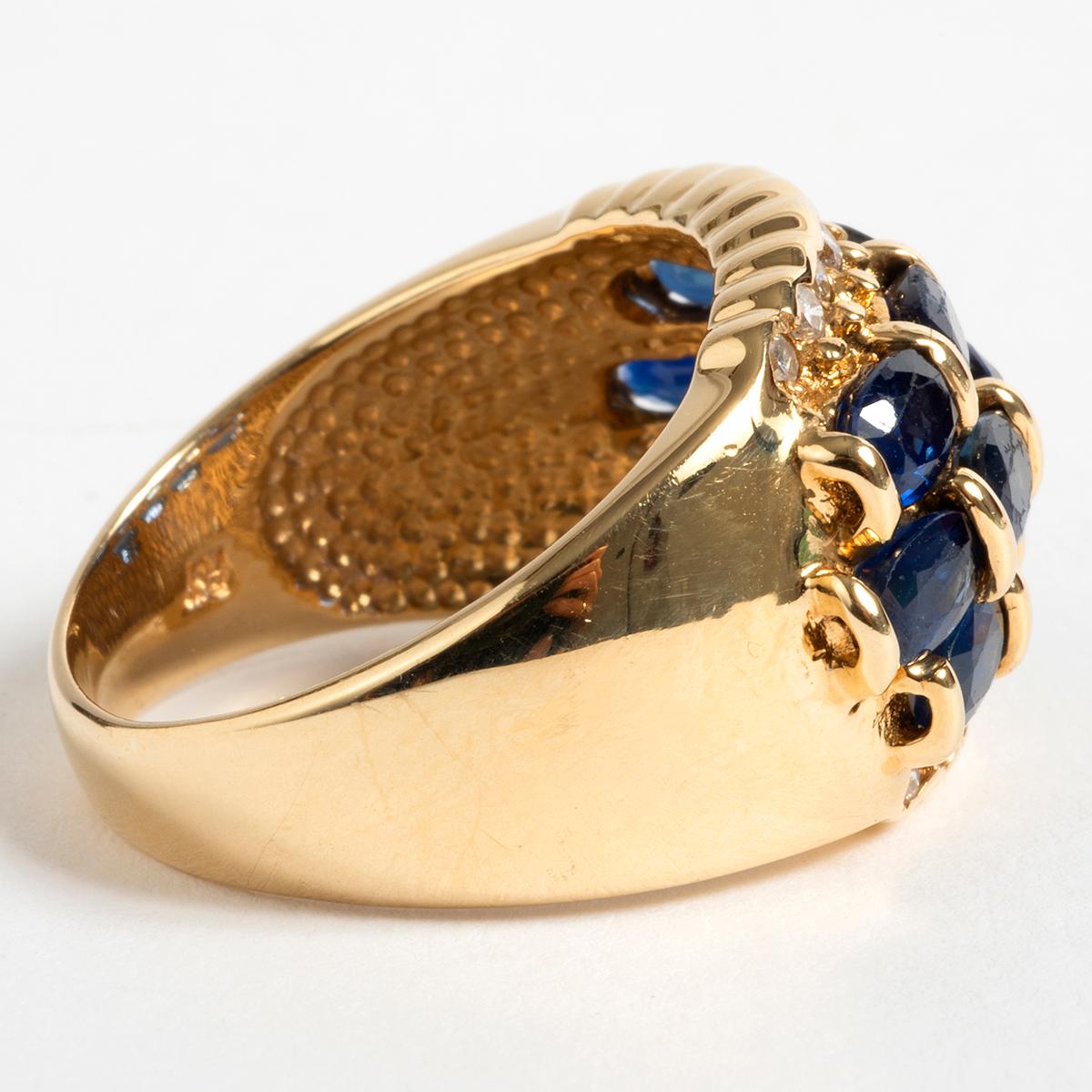 A unique piece within our carefully curated Vintage & Prestige fine jewellery collection, we are delighted to present the following:

This glamours piece, comes set in 14 carat yellow gold surrounded by sapphires and diamonds.  This ring comes in UK