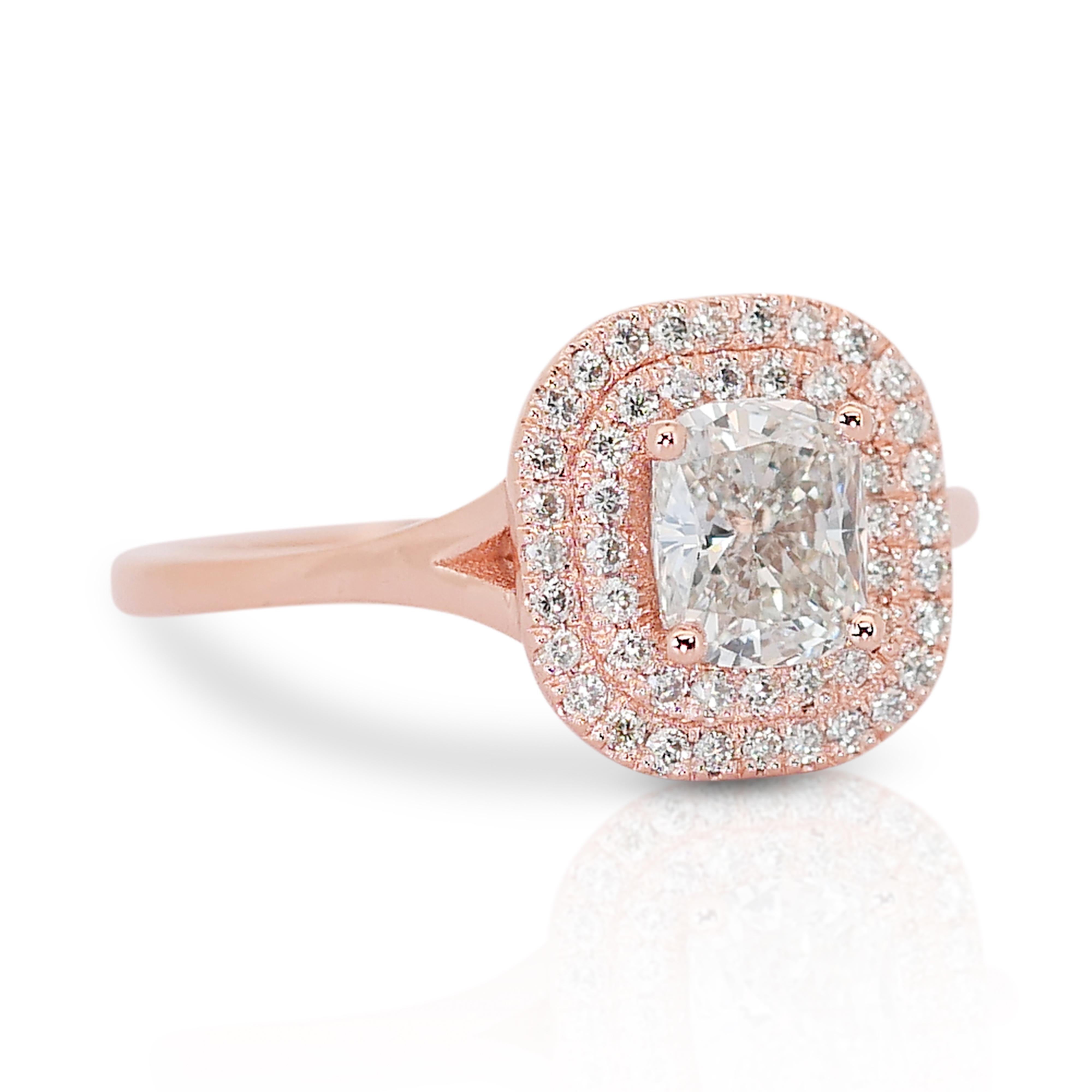 Glamorous 14k Rose Gold Double Halo Diamond Ring w/1.09 ct - IGI Certified

Immerse yourself in the allure of this magnificent 14k rose gold ring, featuring a captivating 0.85 ct rectangular cushion main diamond. Surrounded by 48 round side diamonds
