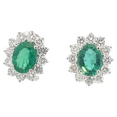**Glamorous 18K Gold Emerald and Diamond Halo Earrings**