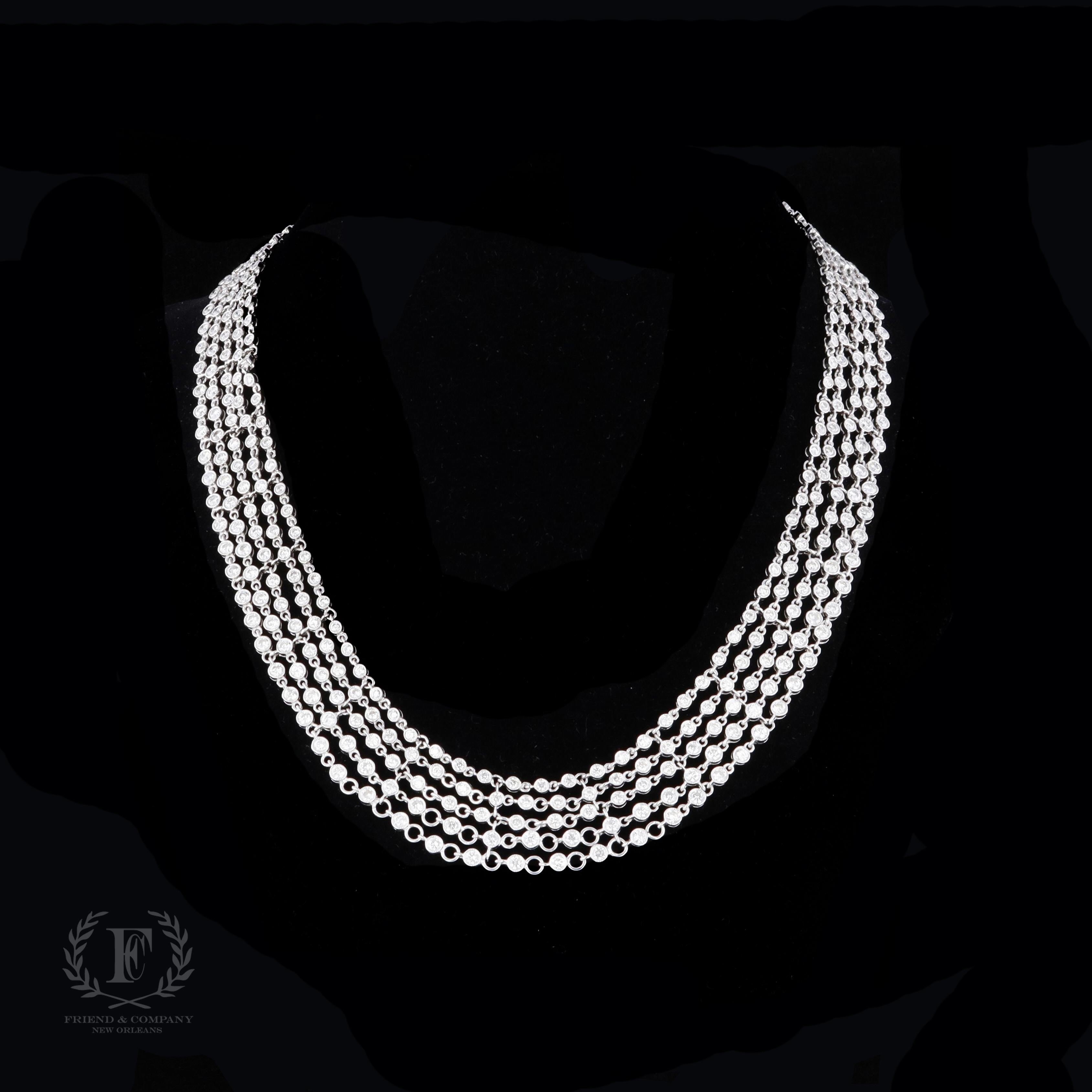 This necklace is the epitome of elegance and glamour. This beautiful 18 karat white gold multi-strand diamond necklace features 420 round diamonds with a total weight of 15.10 carats. The necklace measures 16 inches length.