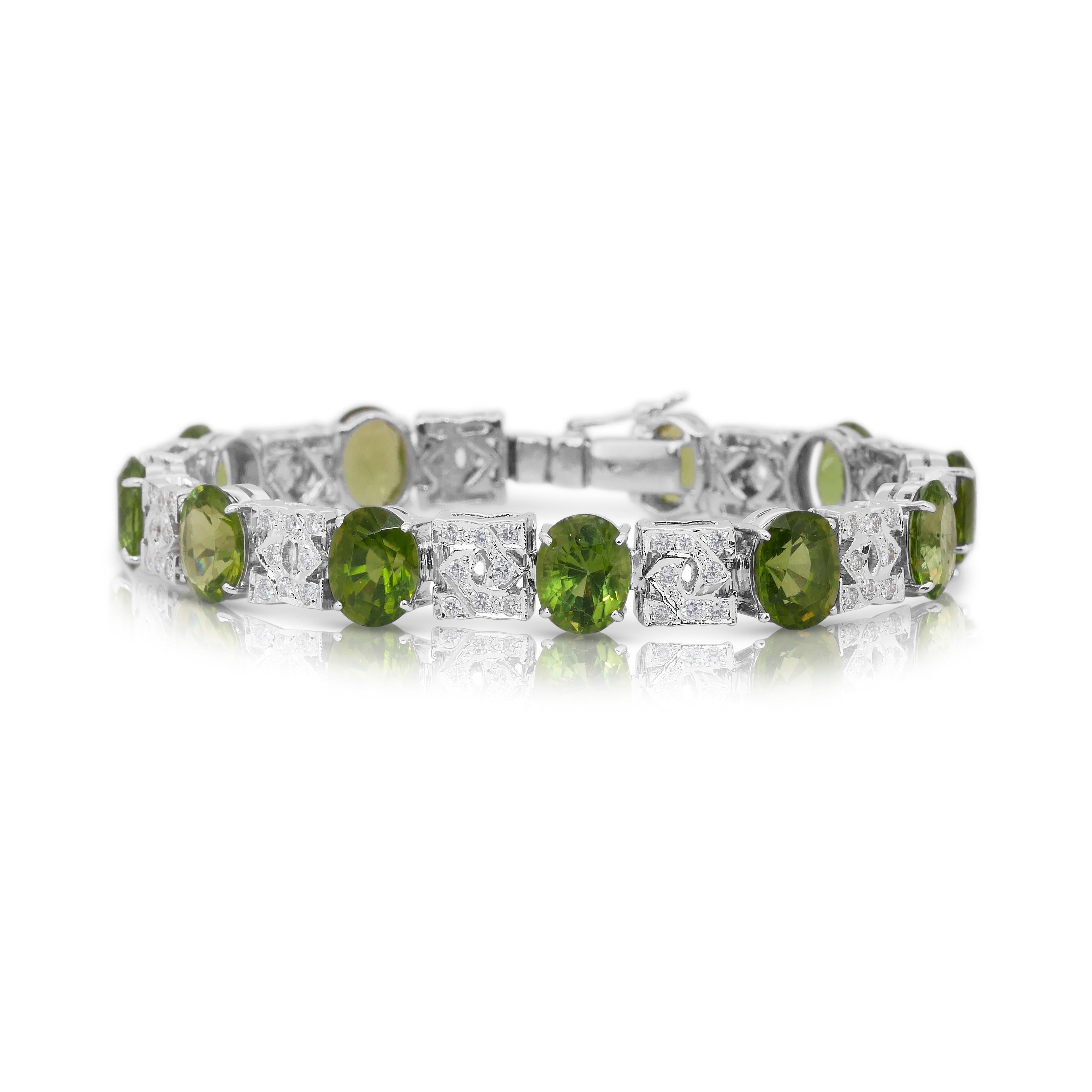Glamorous 27.42ct Peridots and Diamonds Bracelet in 14k White Gold - IGI Certified

A breathtaking statement of elegance, this 14K white gold bracelet showcases 11 vibrant oval peridots totaling 26.30ct in a lively yellowish-green hue, symbolizing