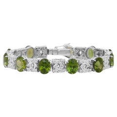 Glamorous 27.42ct Peridots and Diamonds Bracelet in 14k White Gold