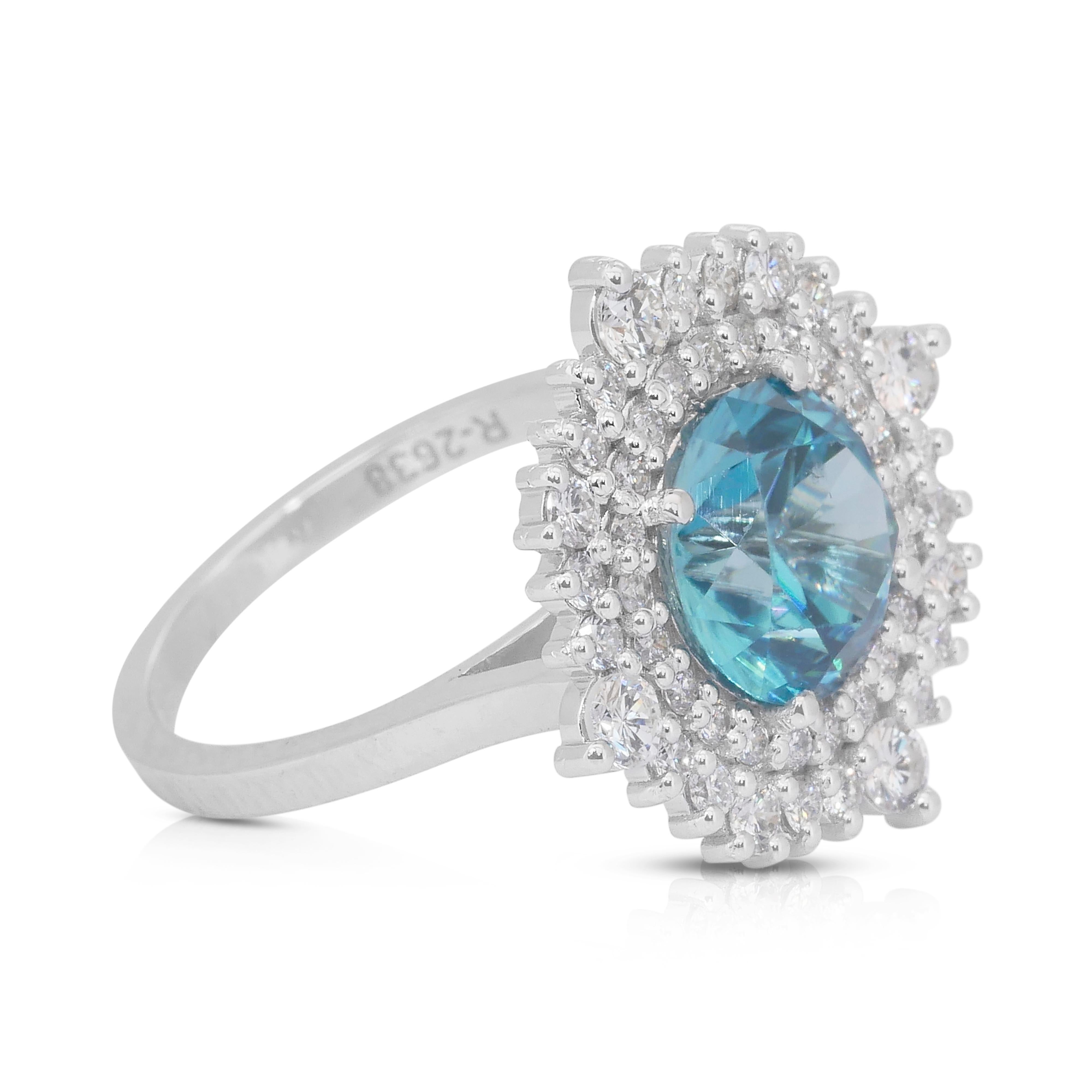 Glamorous 5.03ct Zircon and Diamonds Double Halo Cocktail Ring in 18k White Gold - IGI Certified

Make a dazzling statement with this luxurious 18k white gold double halo cocktail ring, showcasing an exquisite 4.05-carat intense blue round zircon.