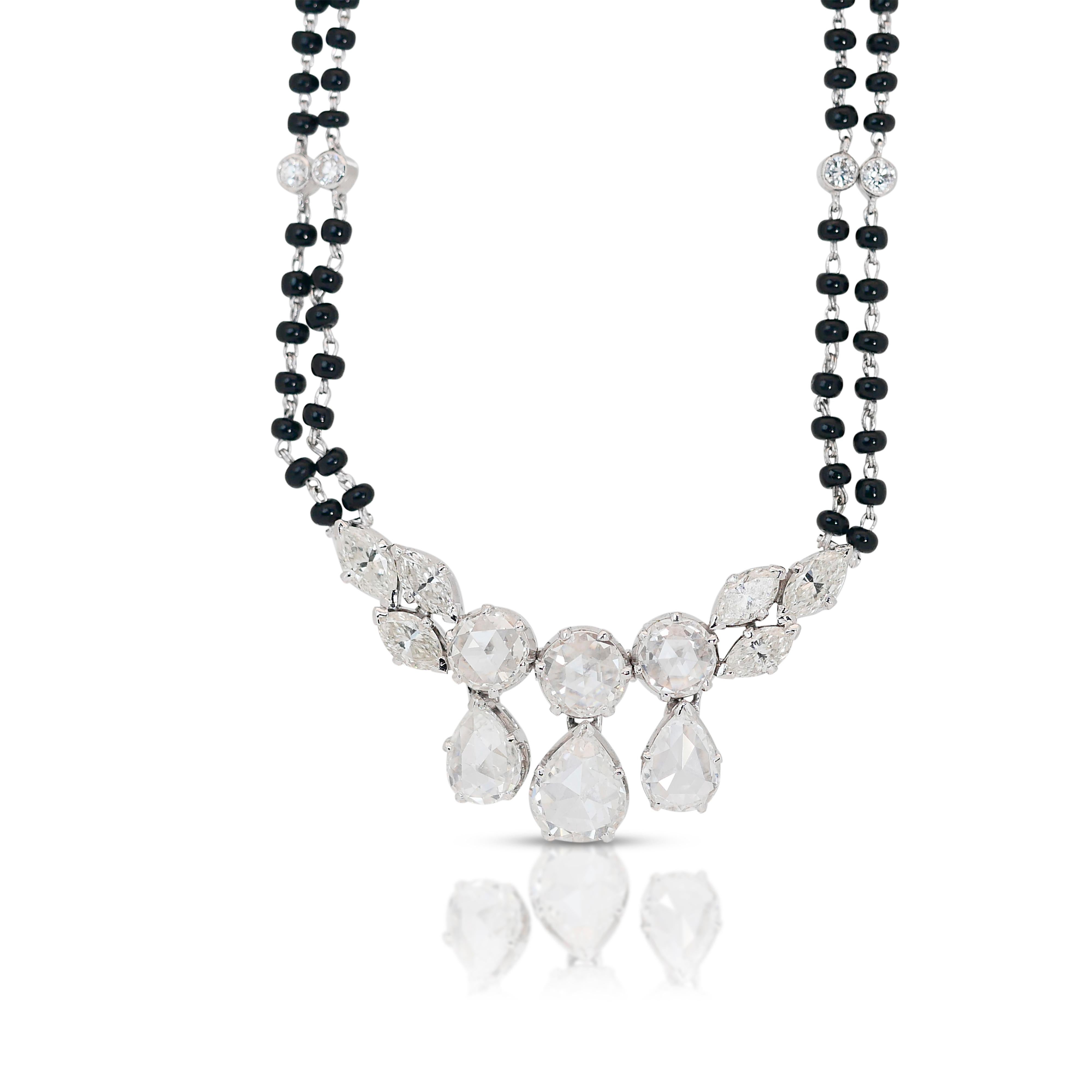 Glamorous 8.02 ct Onyx and Diamond Necklace in 18k White Gold - IGI Certified

Crafted with meticulous attention to detail, this necklace features a stunning array of diamonds totaling 8.02 carats, set against the backdrop of 18k white gold,