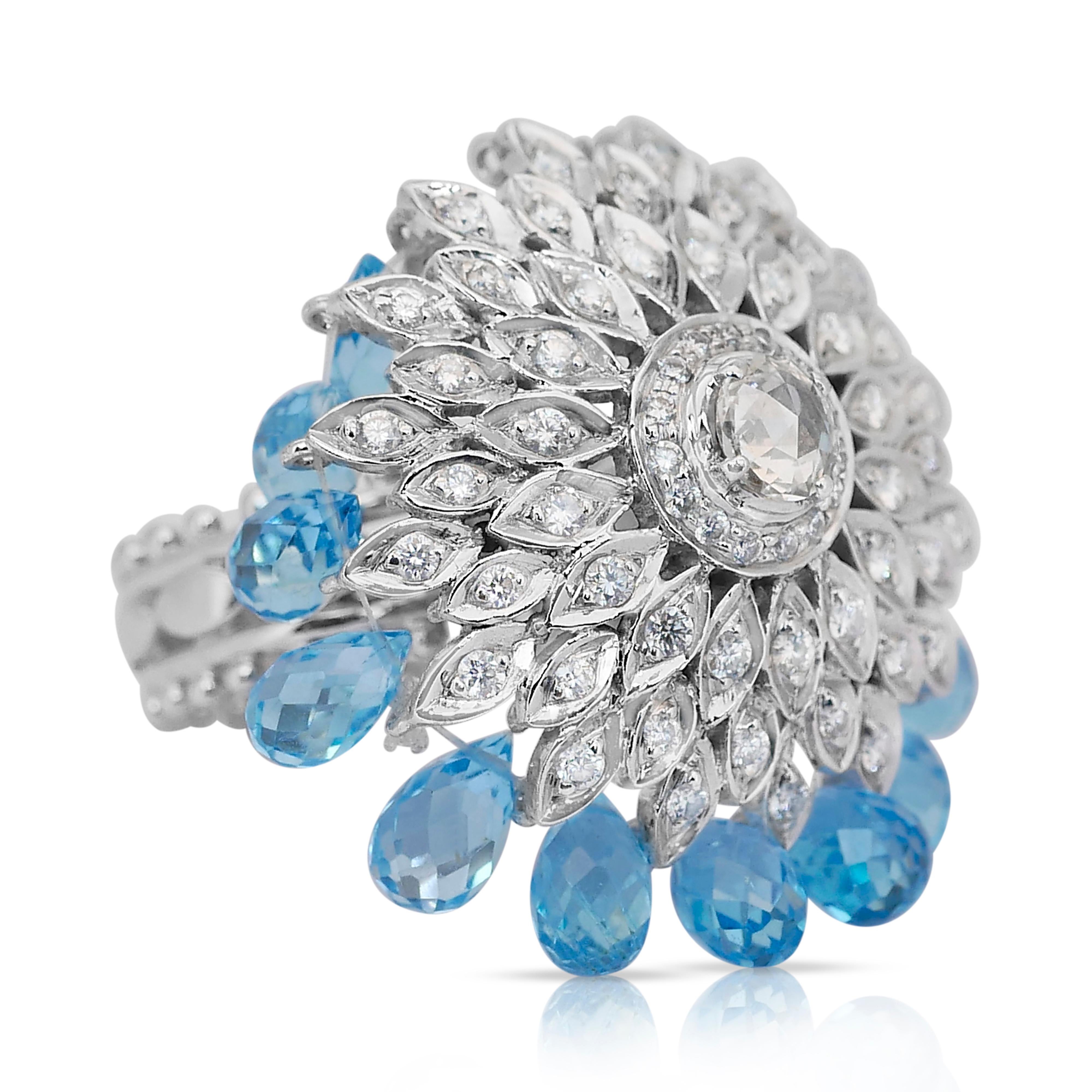 Glamorous 9.50ct Topaz and Diamonds Cocktail Ring in 14k White Gold - IGI Certified

A captivating blend of artistry and elegance, this 14k white gold cocktail ring showcases 16 pear-shaped blue topaz gemstones totaling 8.00ct, creating a