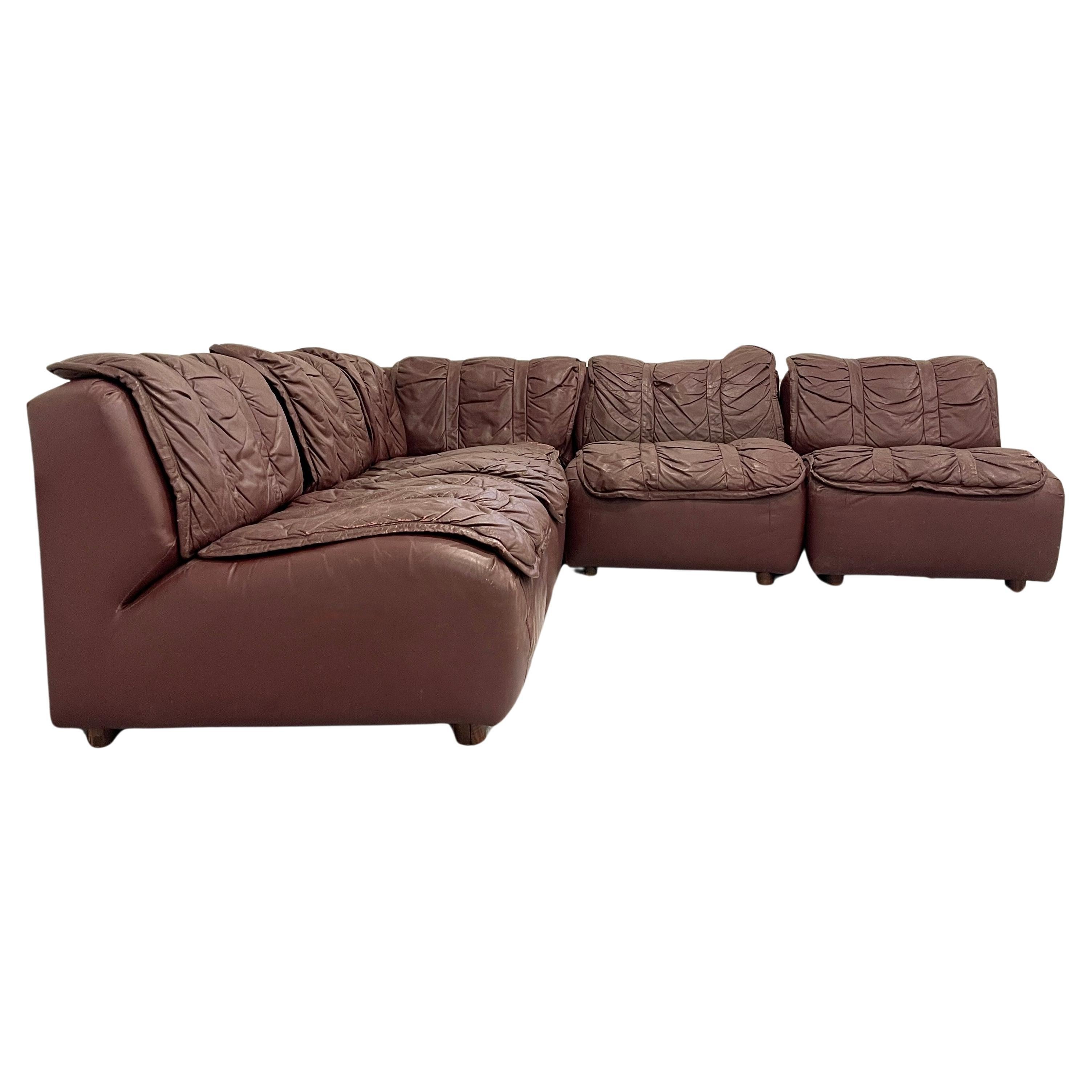 Beautiful perfectly patinated leather sectional from the 1970s.  Very comfortable and can be configured and moved in a number of different ways. Very solid sectional in a deep chocolate brown leather. Each piece can stand alone as a chair as well.