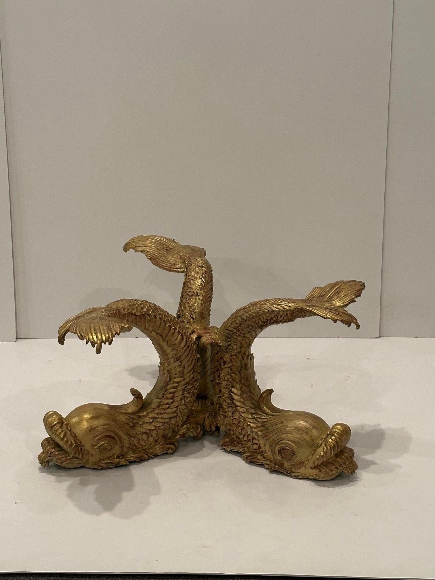 Incredible cast bronze dolphin motif coffee table having round 1” thick glass top.  Beautiful details and super glamorous.
Top of tail 28 diameter 
Diameter 36
Overall height 17 h