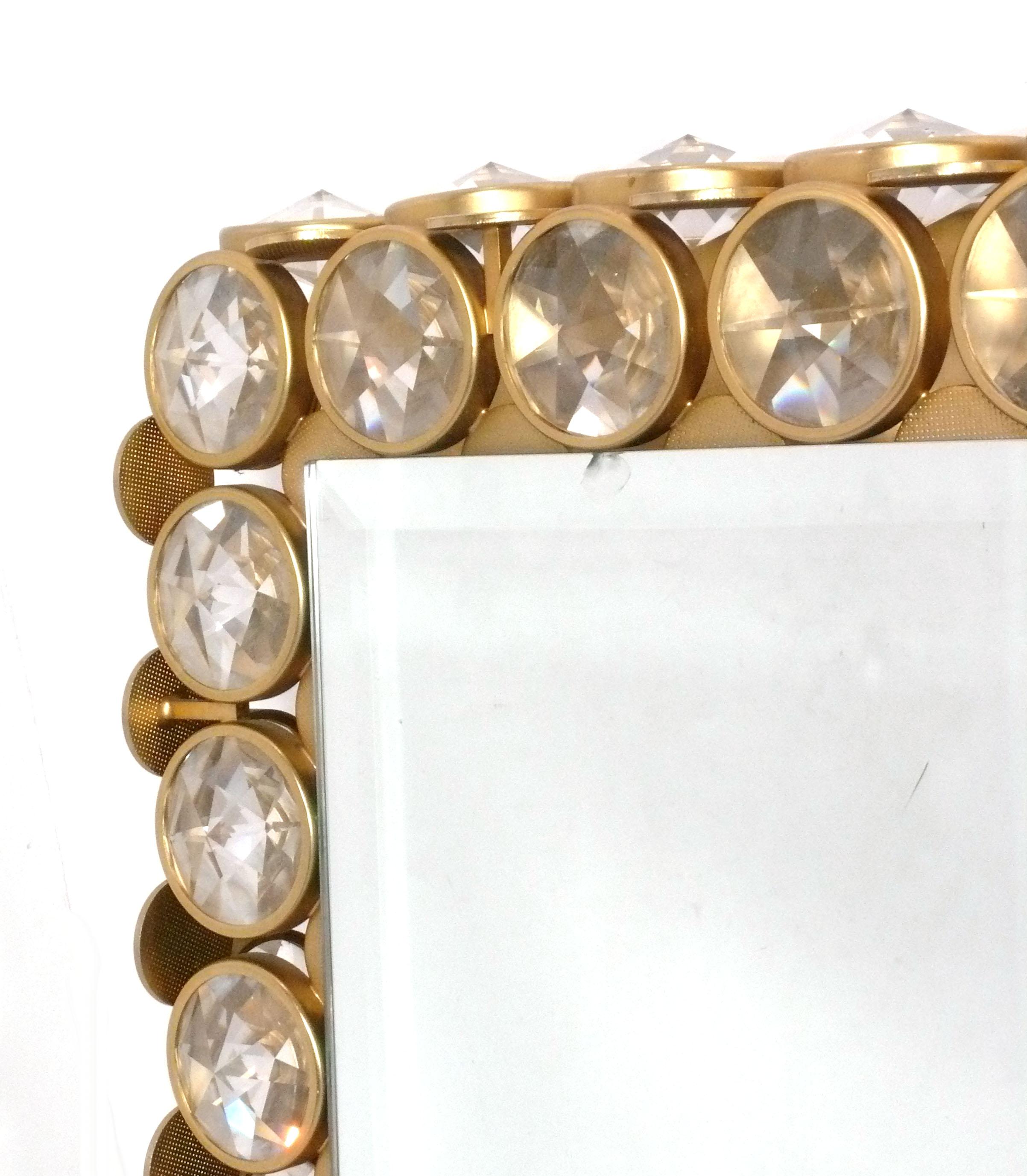 Glamorous Crystal and Brass Illuminated Vanity Mirror, circa 1960s. It measures 18.25